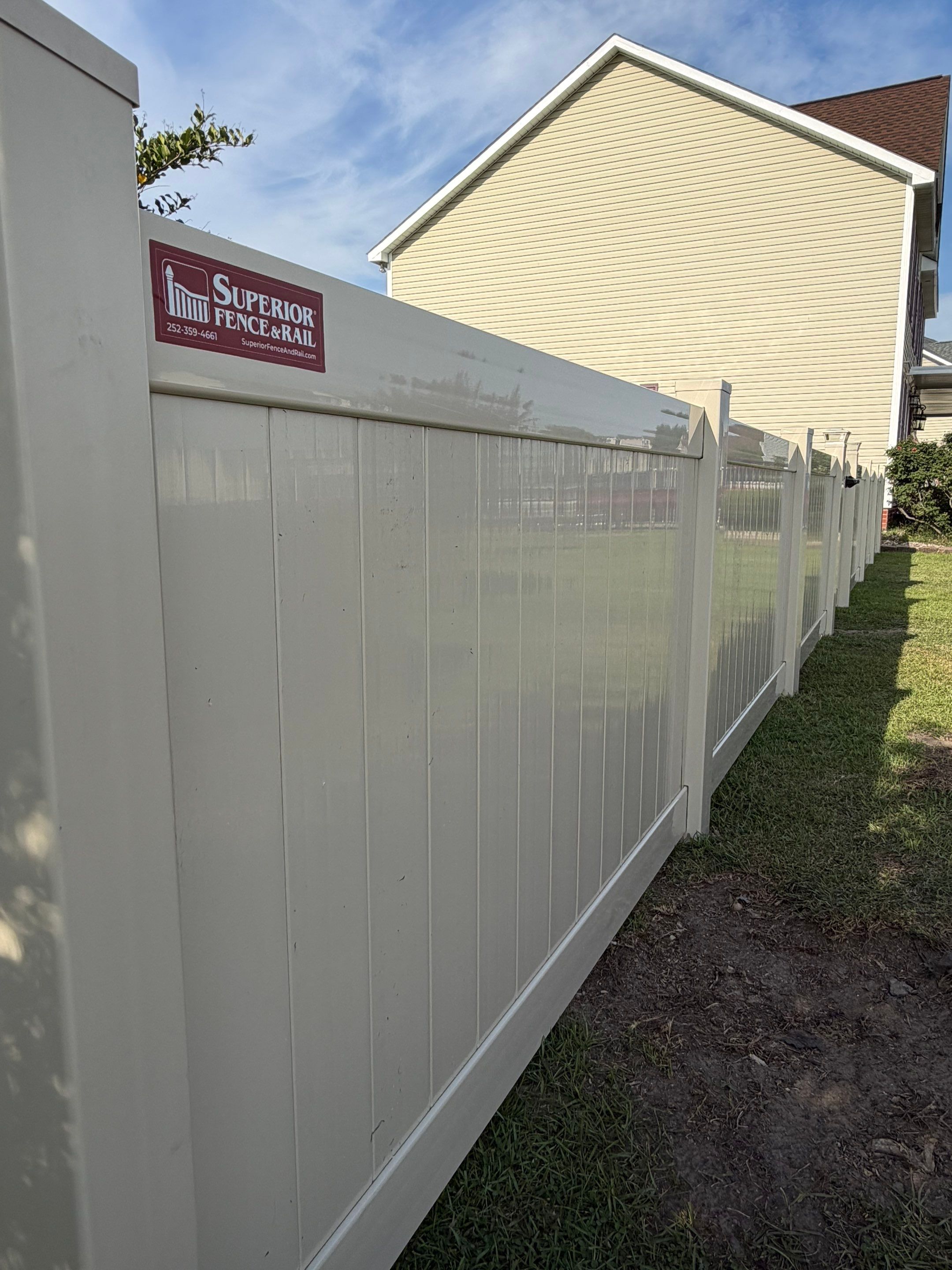 Residential Tan Vinyl Privacy Fence Installation in Winterville by Superior Fence and Rail