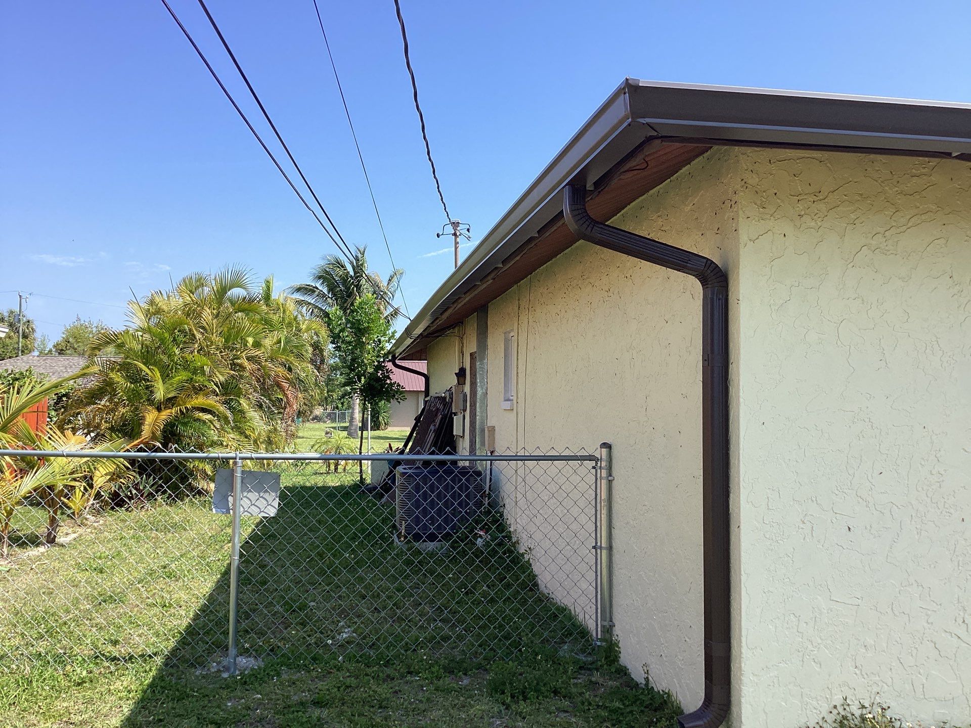 Musket Brown Seamless Gutters using 6 Inch Seamless Gutters in Cape Coral FL by Gutter Professors