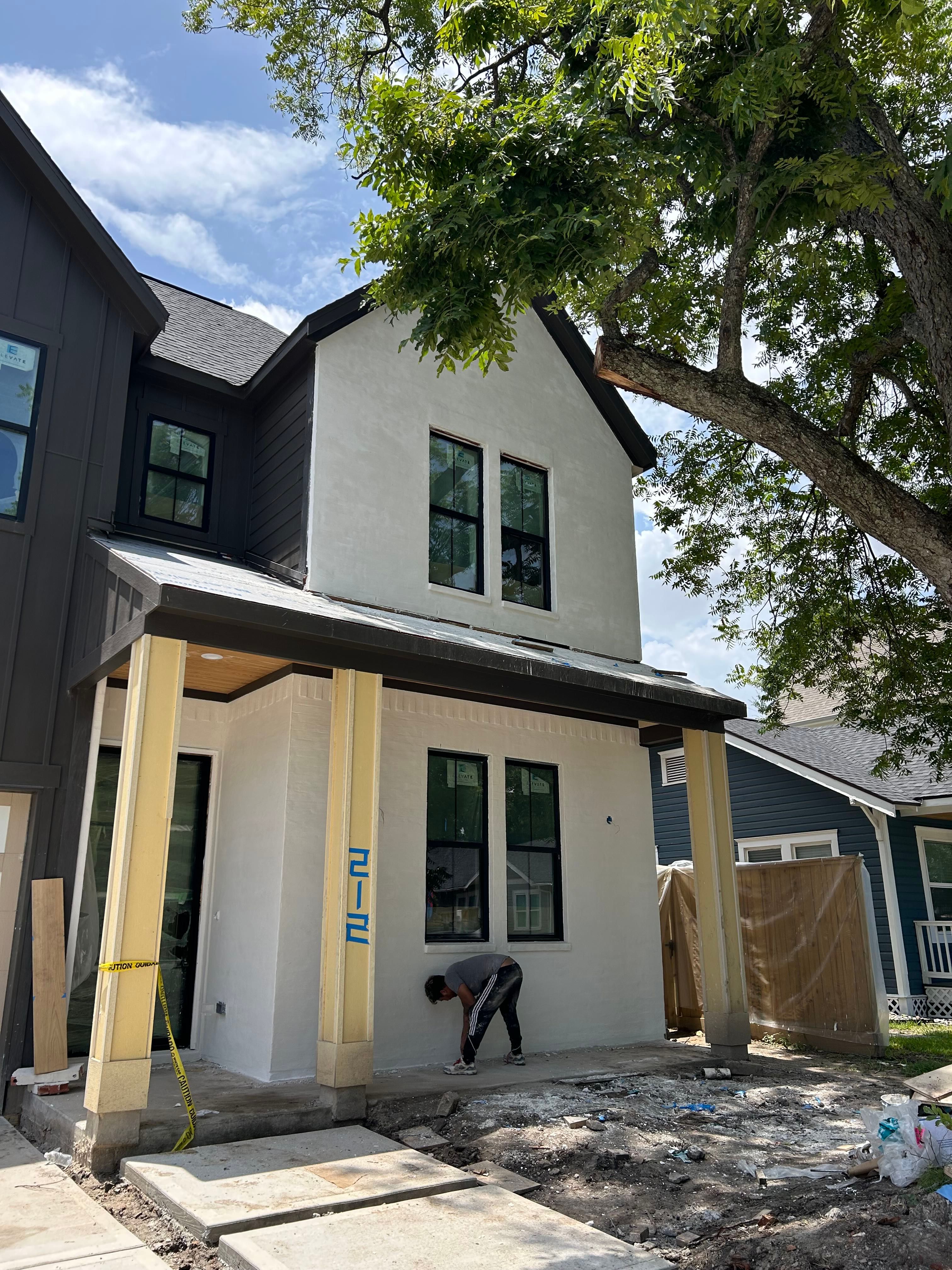 Midtown Elegance: Brickwork with Slurry Finish Refinement by Apex Conventional Stucco Llc