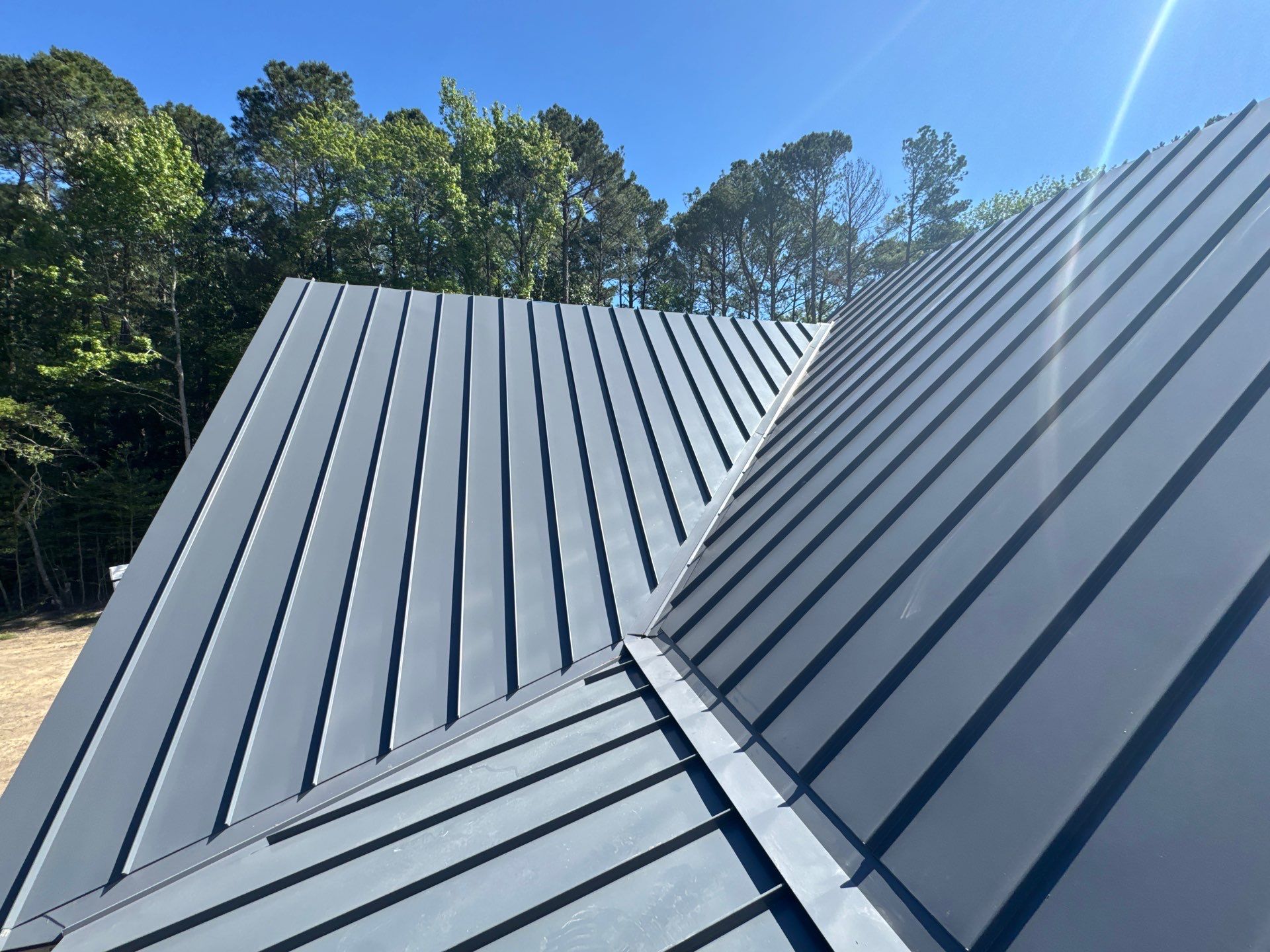Custom New Construction Home Featuring Standing Seam Metal Roofing in Port Haywood by Cade Construction