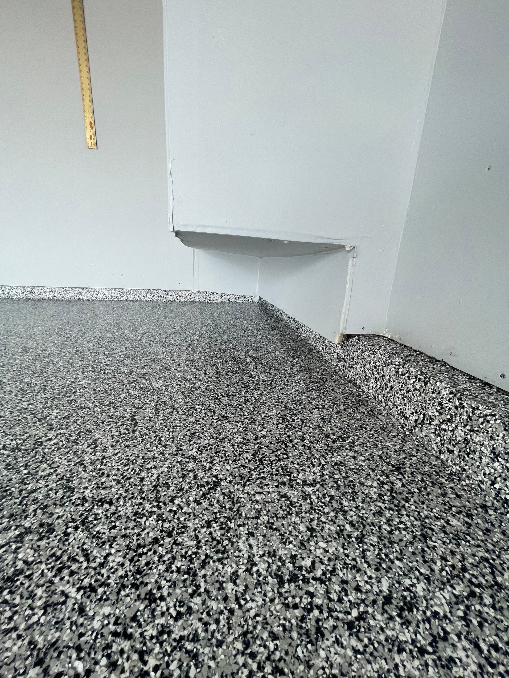 Sioux Falls Garage Concrete Coating Installation with Domino Flake by Select Painting, Coatings & Garage Cabinets