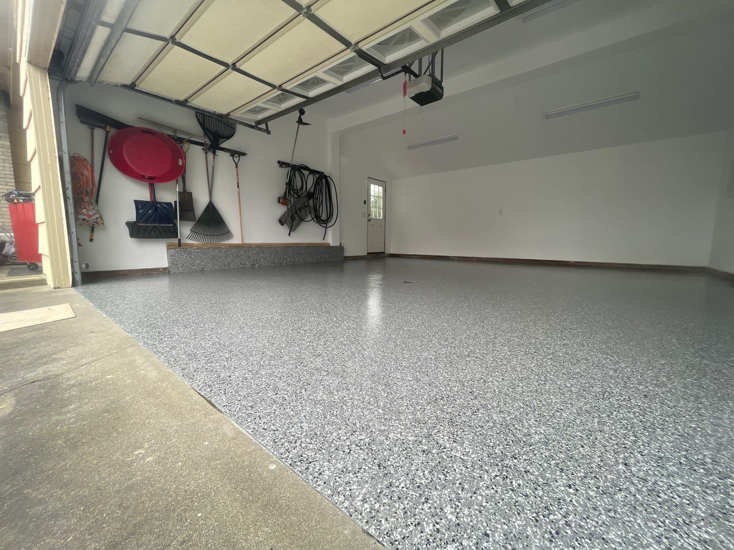 Garage in Shrewsbury, MA 01545 by Symphony Concrete Coatings