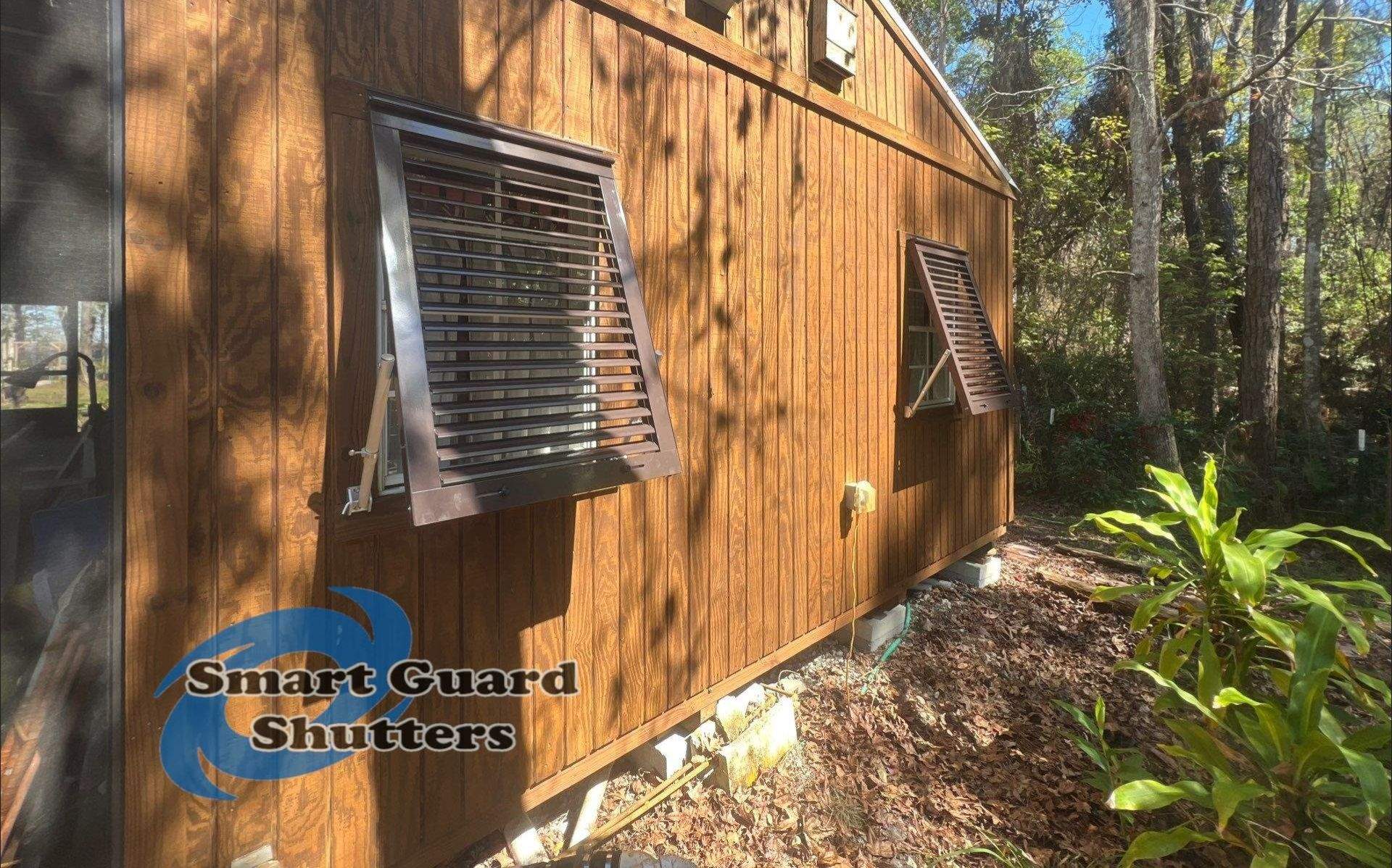 Hurricane Protection in Bronze/Grey Brown by Smart Guard Shutters