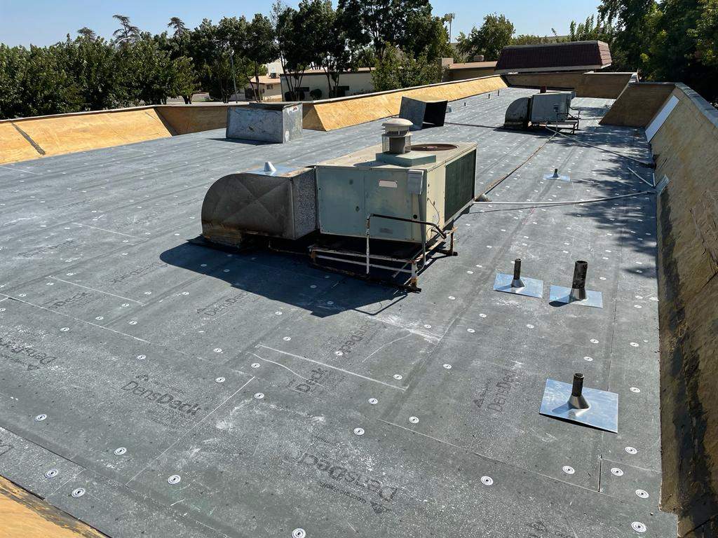 Commercial Roofing Installation using General Coatings acrylic coatings and spray foam by Straight Edge Roofing Inc
