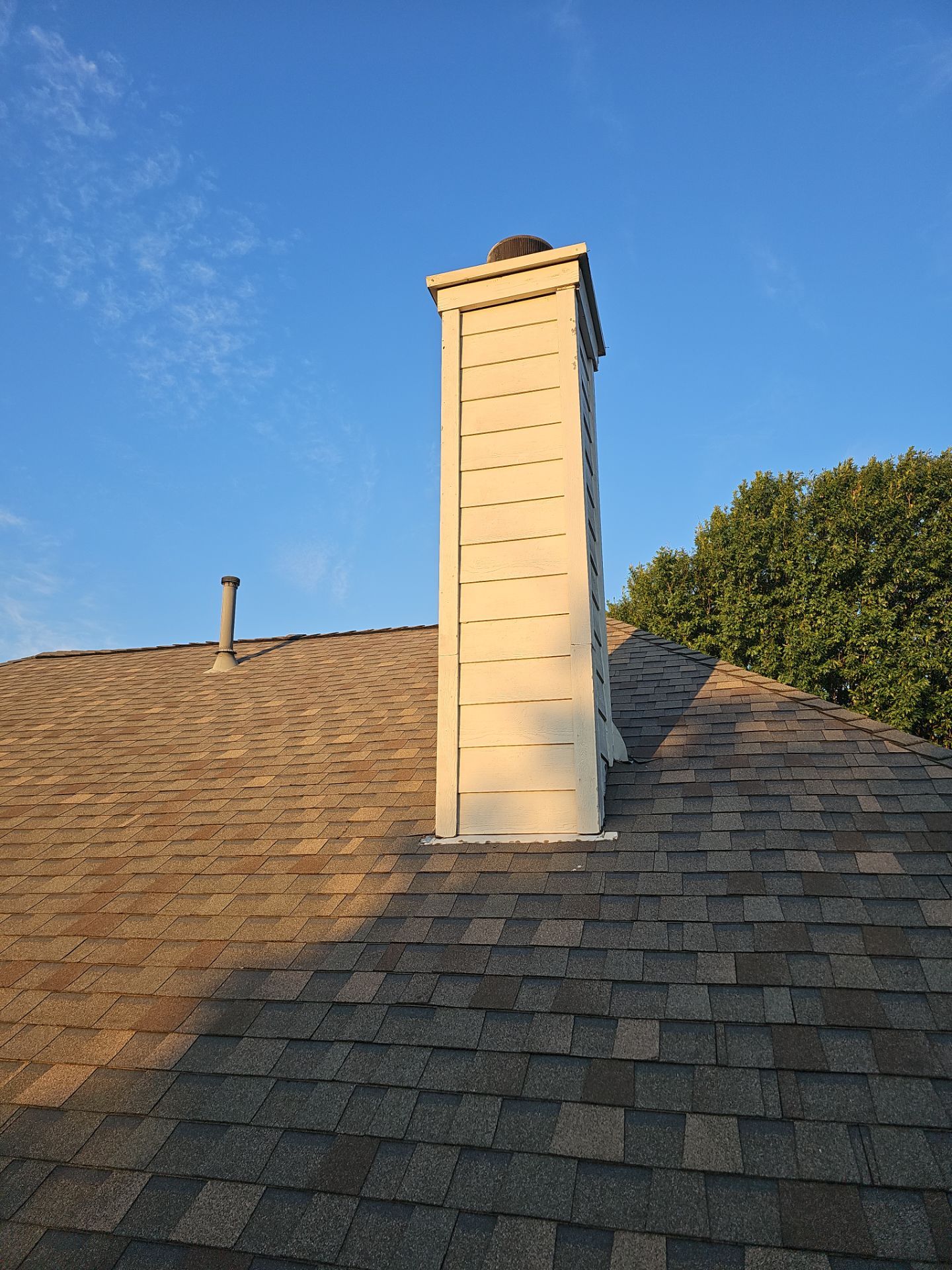 chimney repair using lap engineered treated composite siding. by road roofing llc
