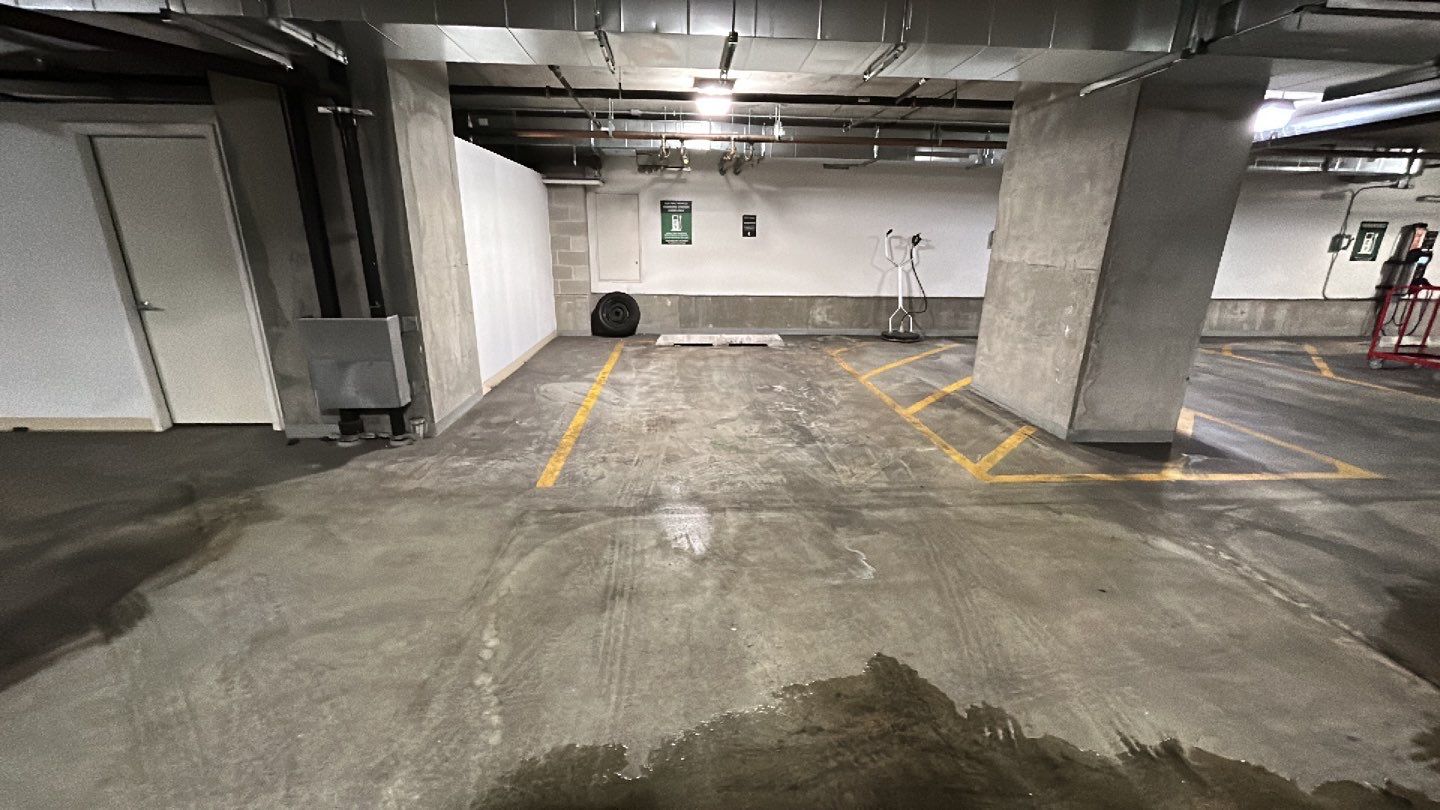 Parking garage using Hot water by Northern Power Washing LLC.