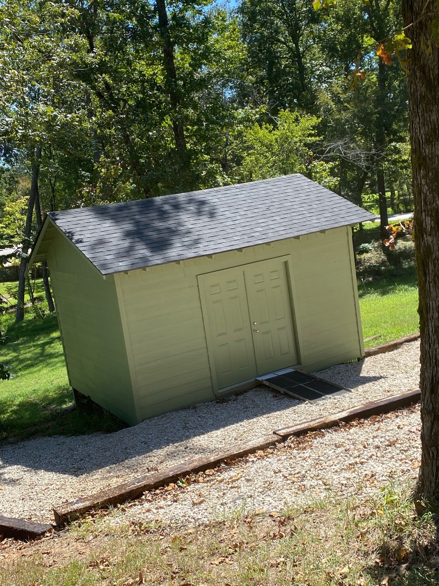 Exterior Repaint – Tyler, Texas - Bold green color with black garage by Quality Coats Painting