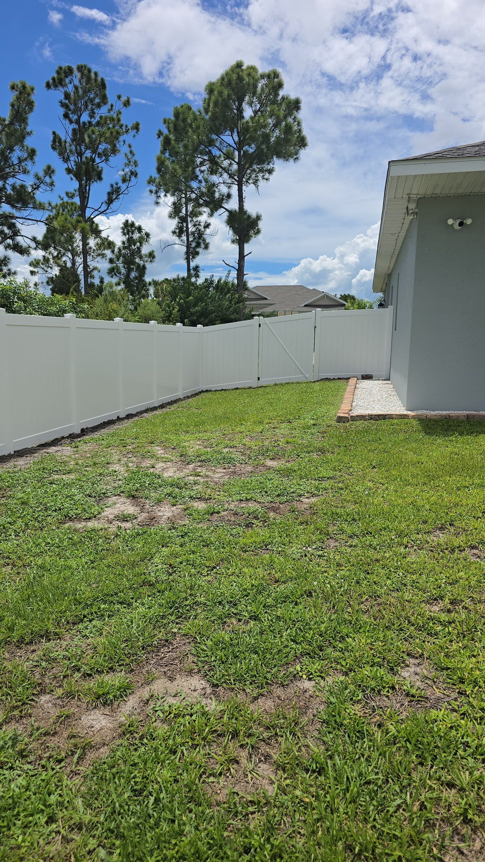 White Vinyl Privacy Fence Installation in Port Charlotte Florida by True Fence LLC