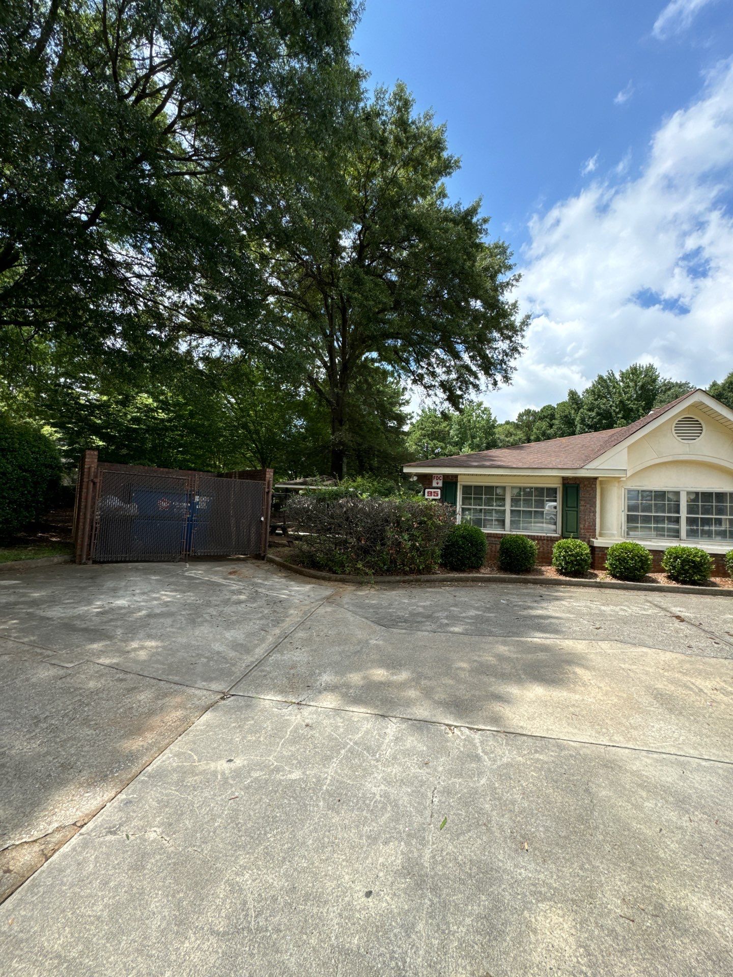Commercial Exterior Brick and Stucco Painting in Fayetteville by Swift Home Renovations