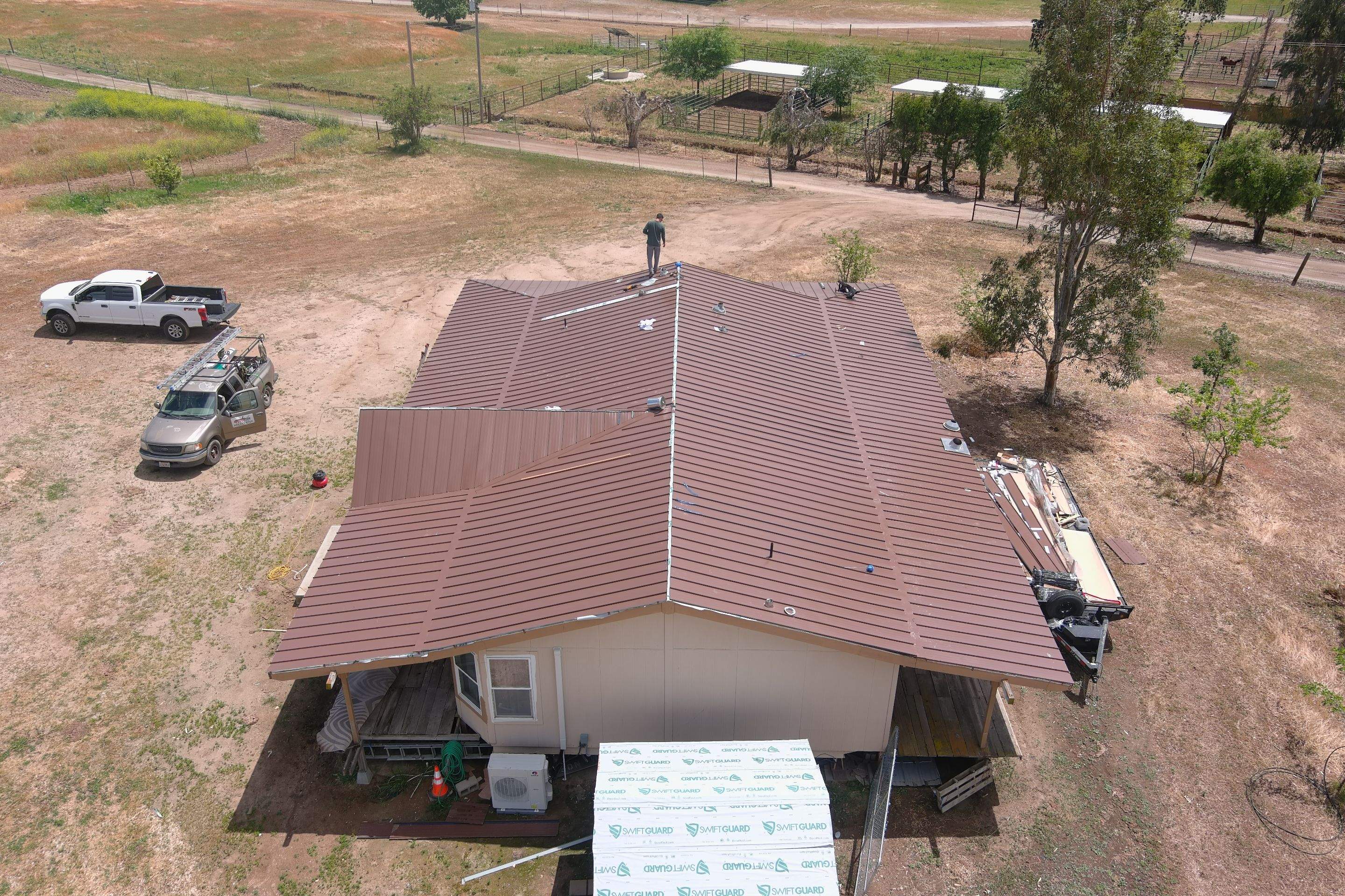 Metal roofing installation using Standing seam metal roofing system by Straight Edge Roofing Inc