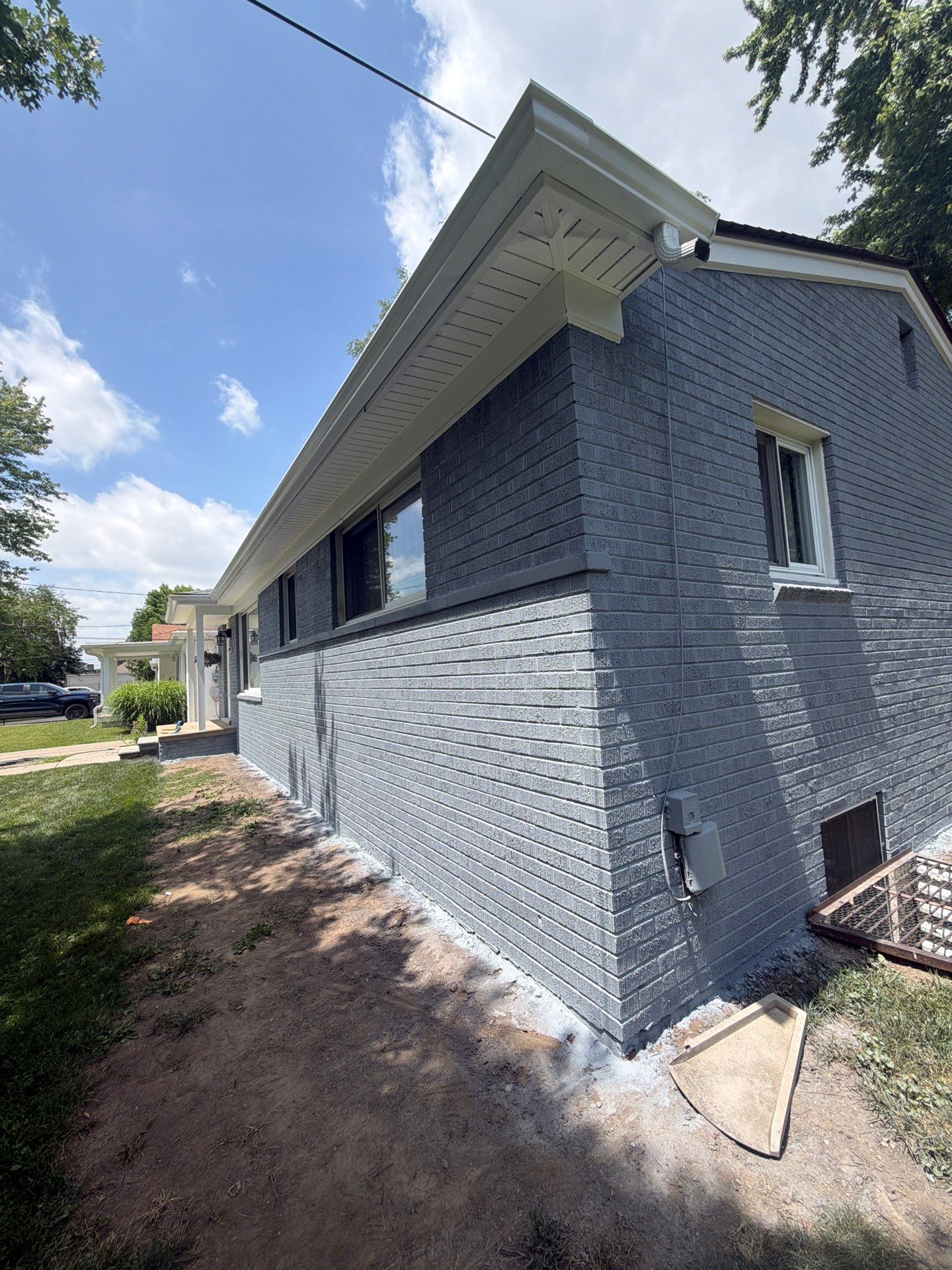 Exterior Brick Staining Transformation by Top Shelf Painter