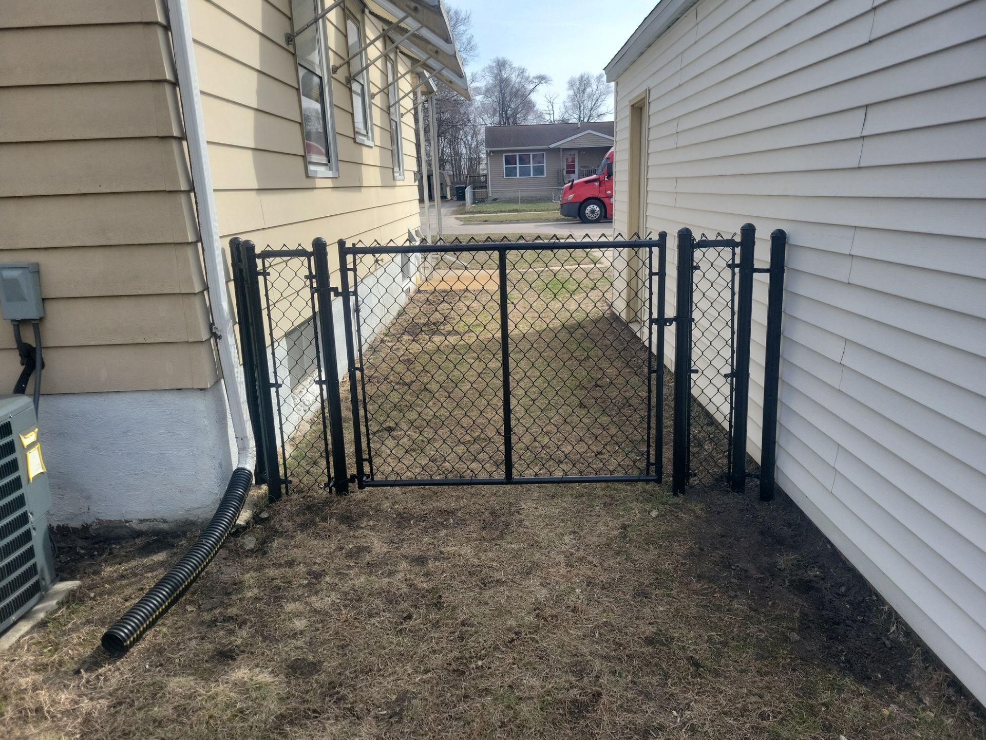 Black Chain Link Fence and Gate Installation in Waterloo by Perfect Picket Fence and Stain