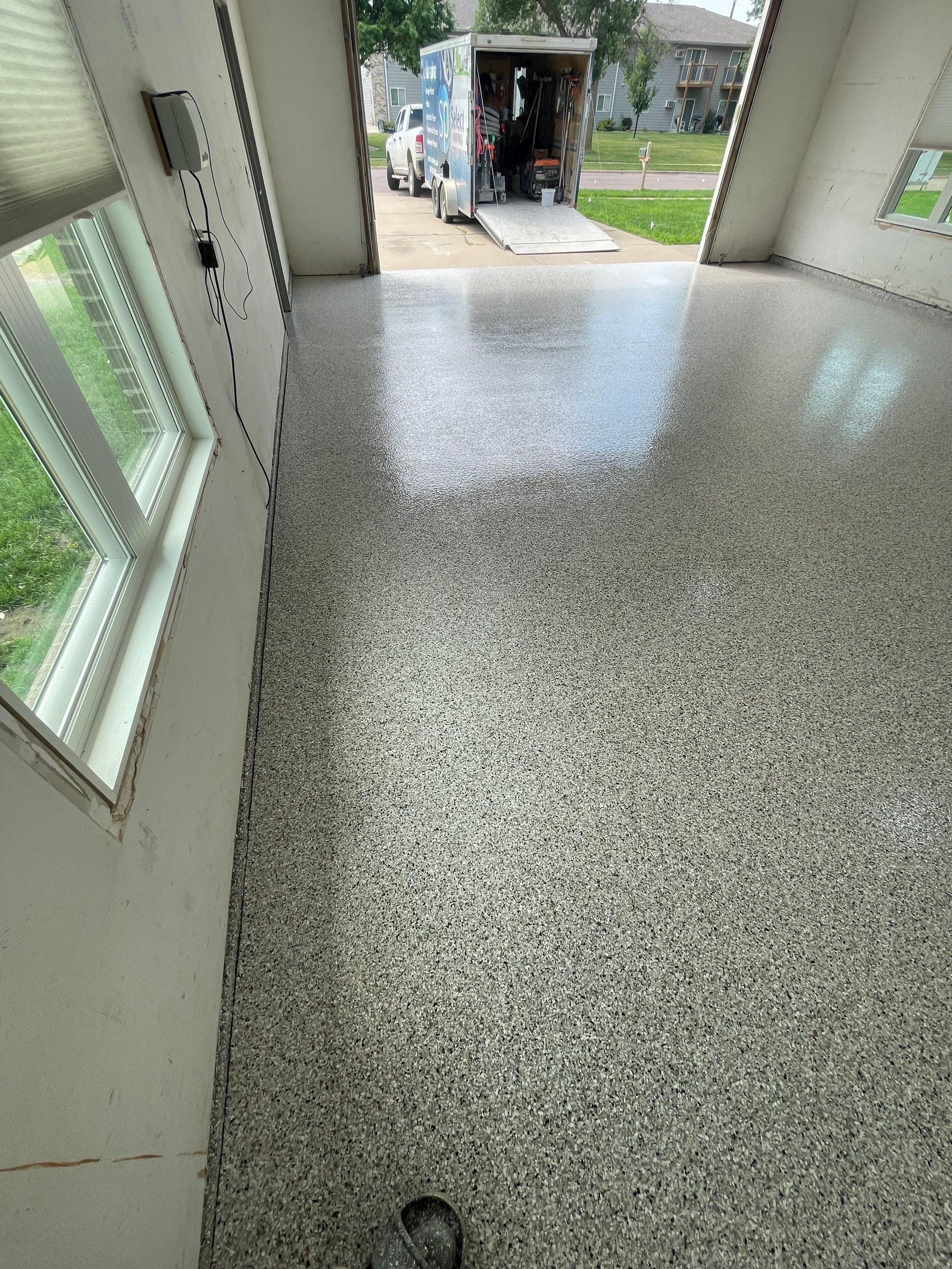 Coyote Flake Concrete Coating for Sioux Falls Garage by Select Painting, Coatings & Garage Cabinets