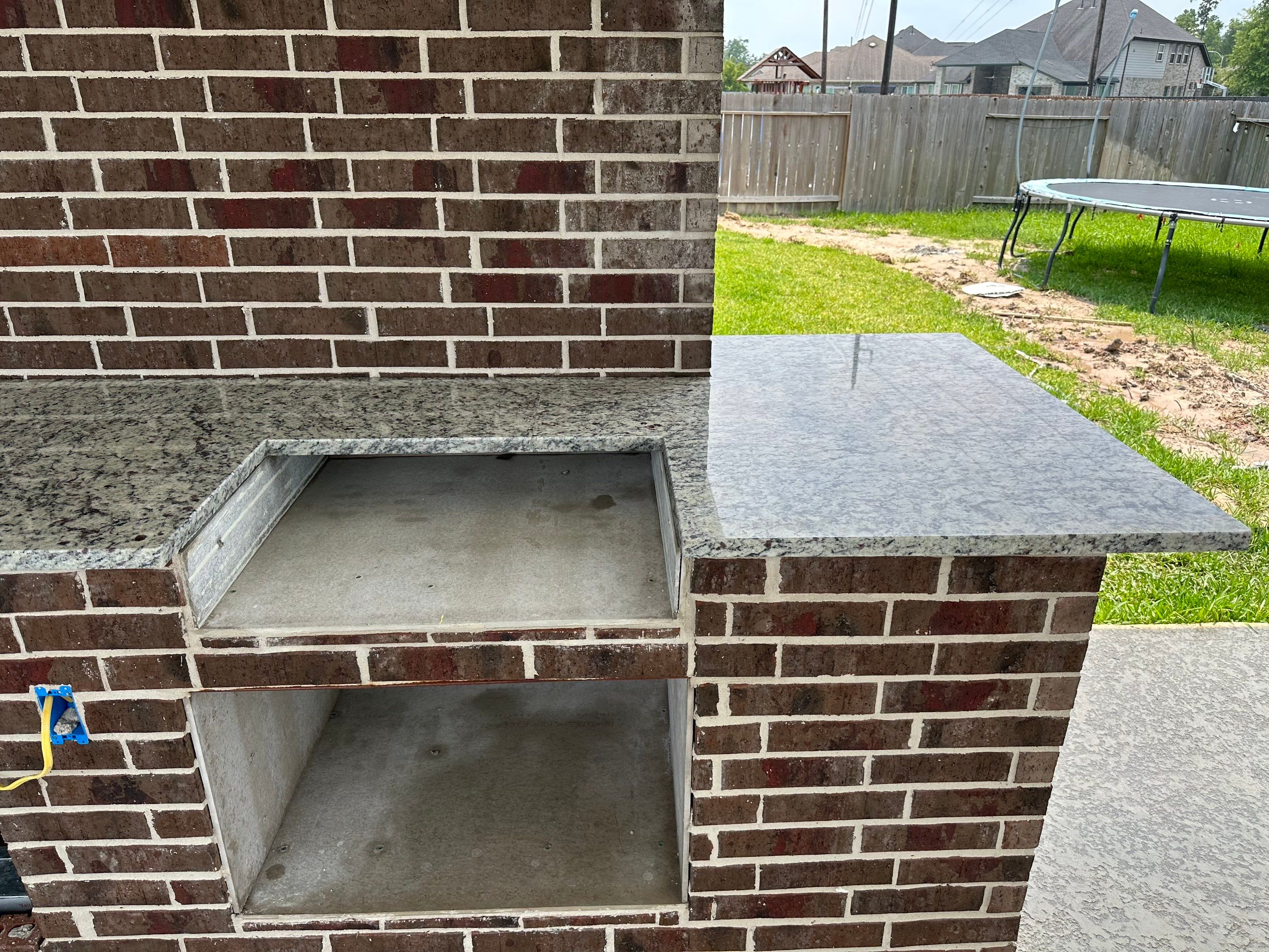 Covered patio and Summer Kitchen in Spring, TX by SophAlx LLC