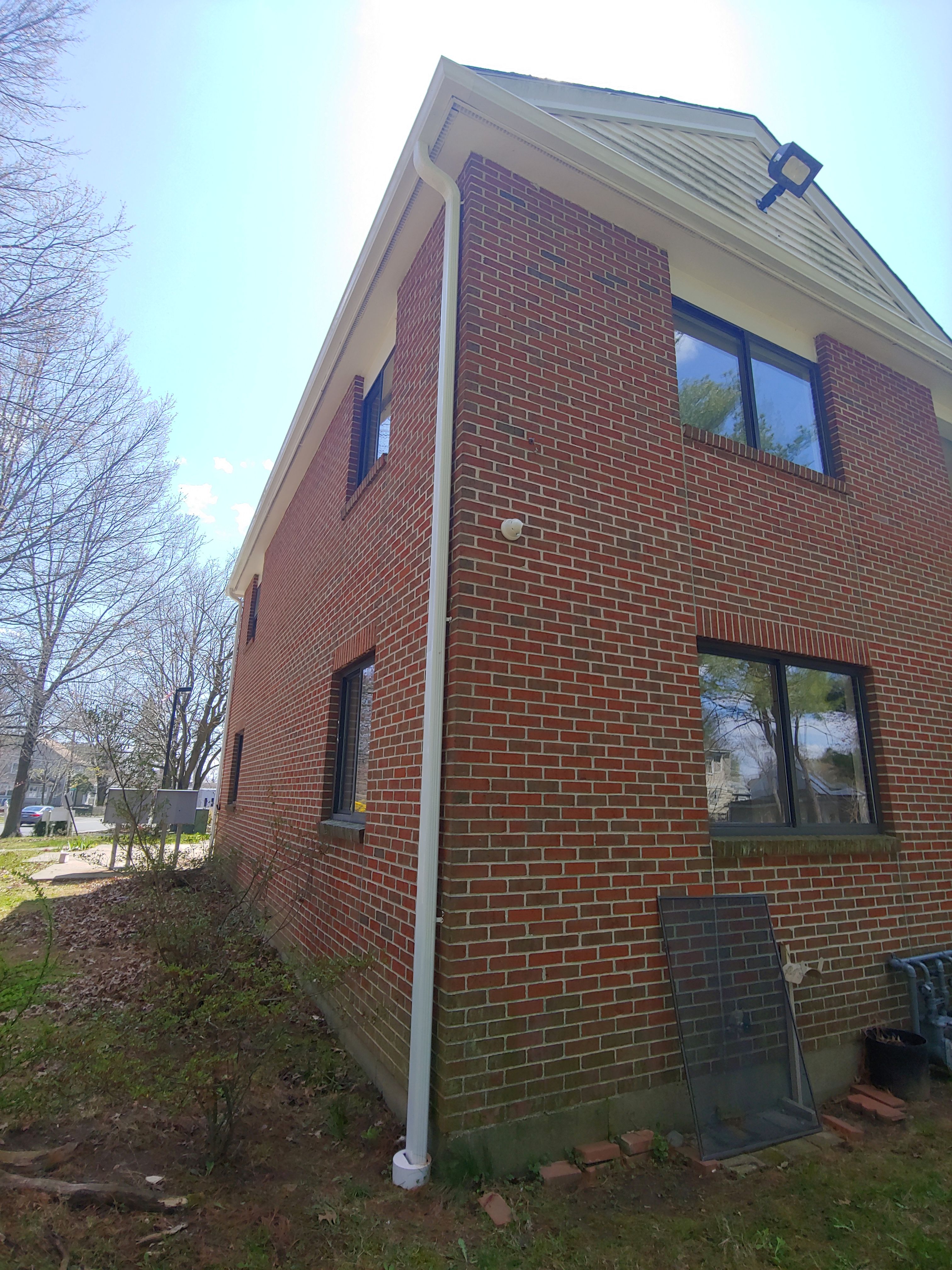 Commercial Roofing Installation using EPDM with white gutters by A Plus Exterior