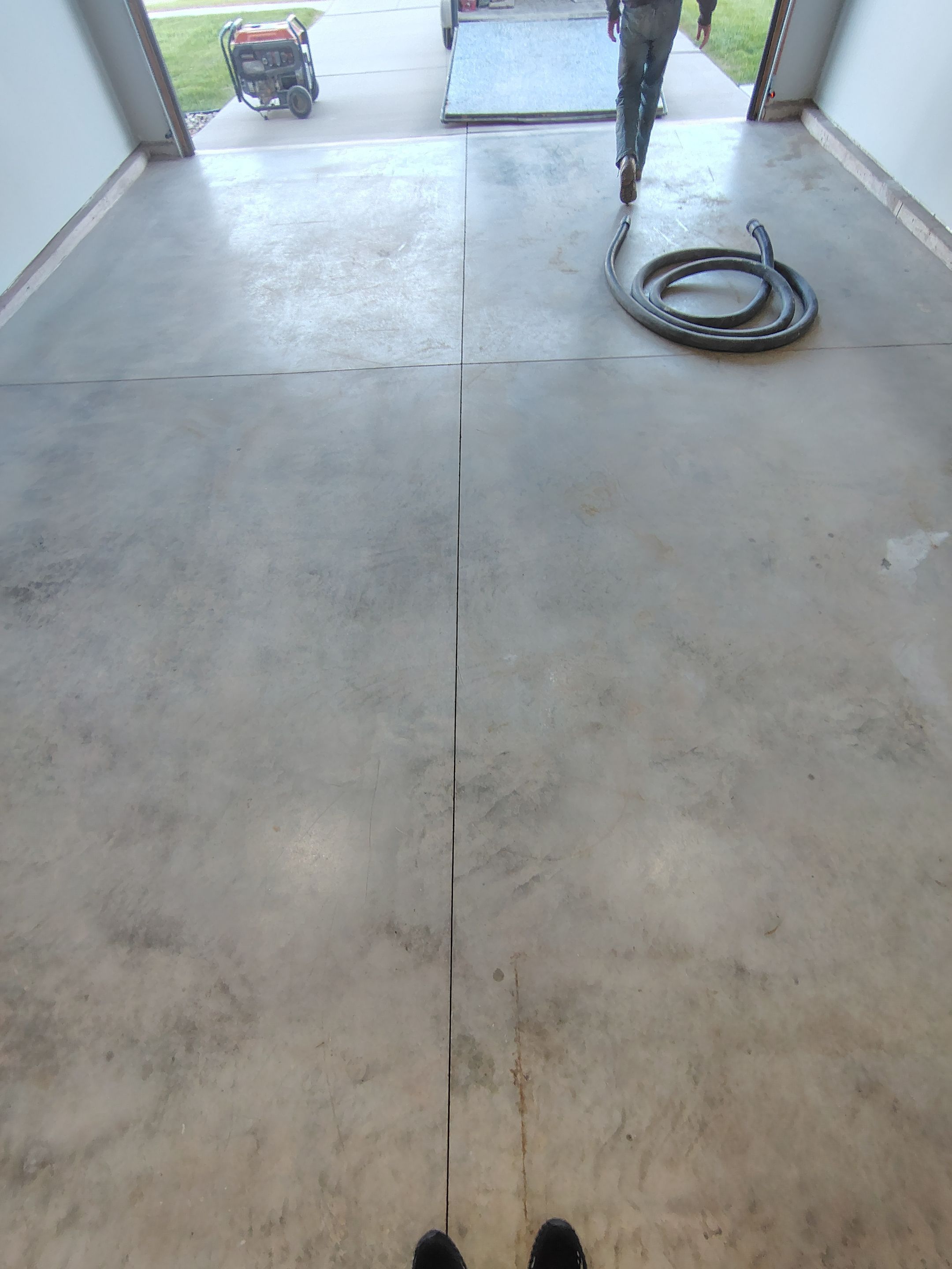 Custom Epoxy Garage Floor Coating Installation in Sioux Falls by Select Painting, Coatings & Garage Cabinets
