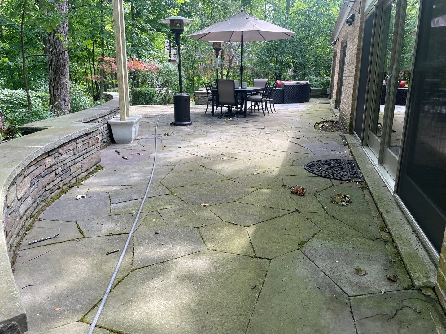 Bluestone patio cleaning by Northern Power Washing LLC.