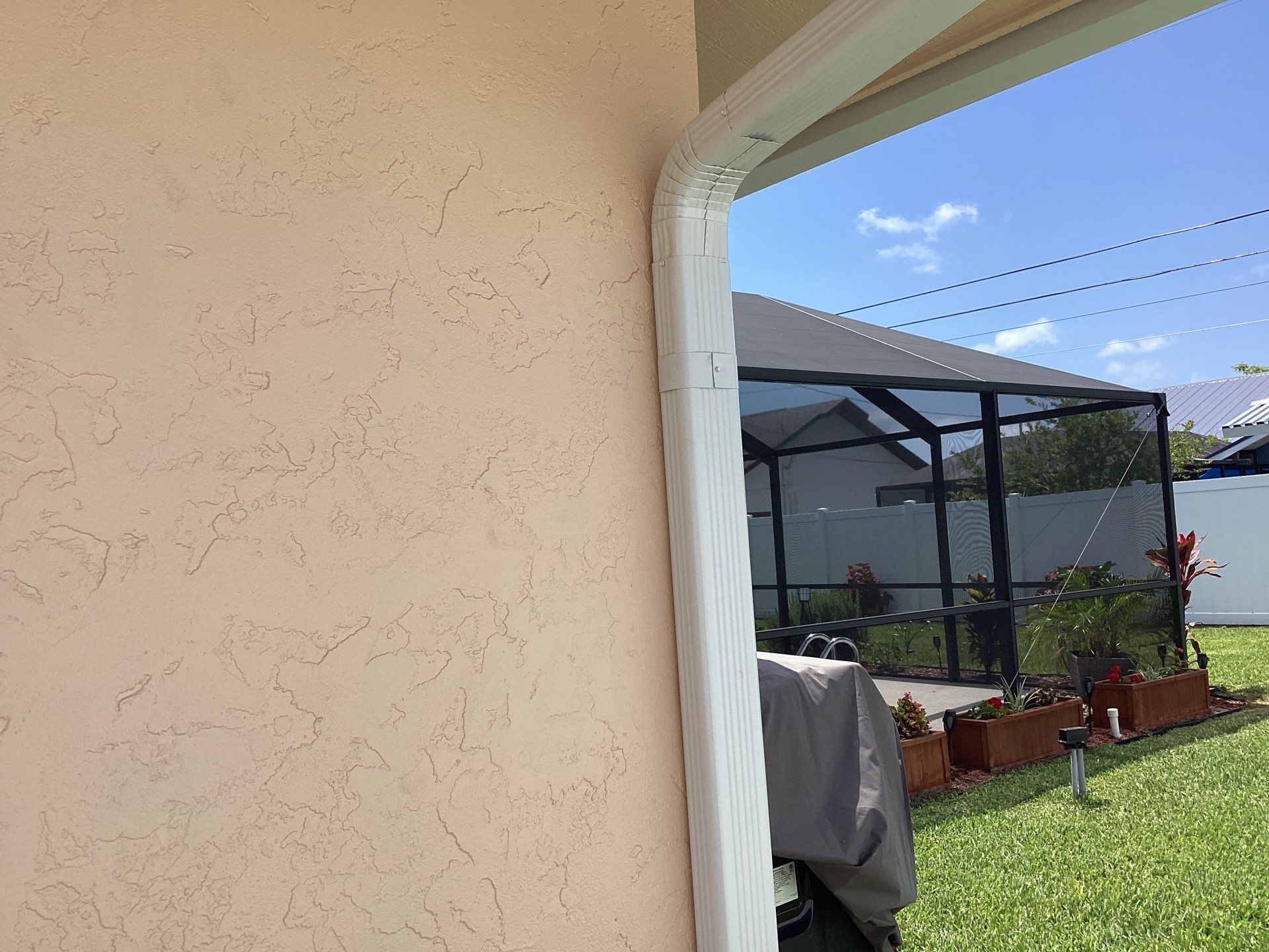 White K Style Seamless Gutters using 3X4 Elbow Downspout in Cape Coral FL by Gutter Professors