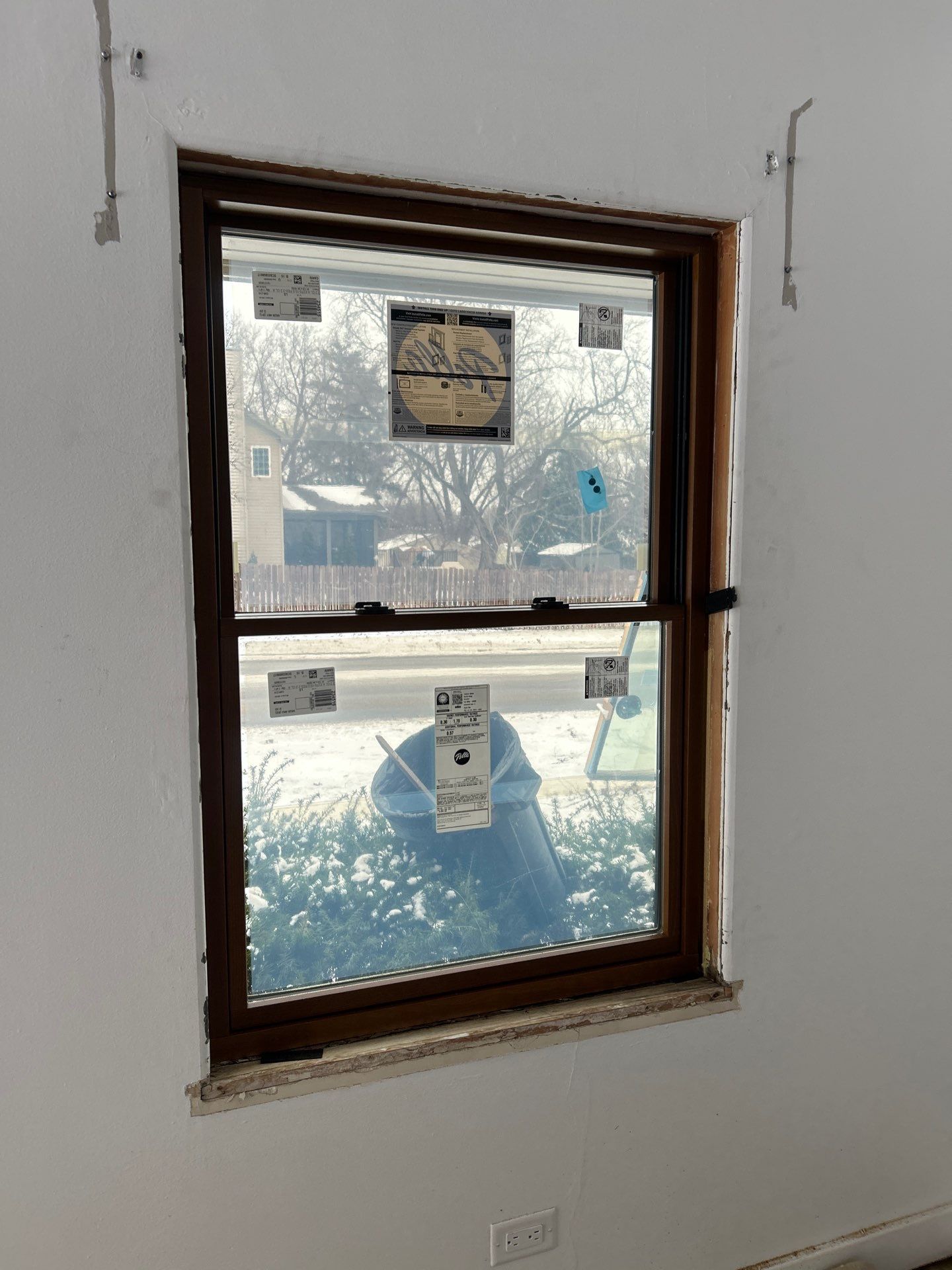 Black-Frame Pella Lifestyle Upgrade on a Partial Brick Home by United Windows and Siding LLC