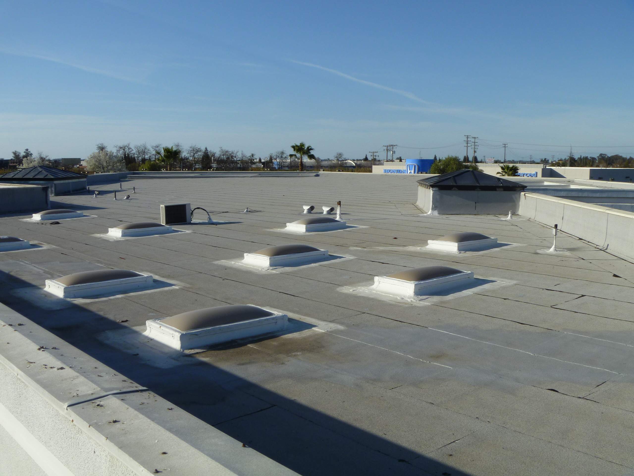 Commercial Roofing Installation using Spray foam and Conklin Benchmark/PUMA XL 18 yr warranty coatings by Straight Edge Roofing Inc