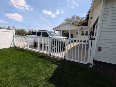 White Vinyl Privacy and Picket Fence Installation in Waterloo