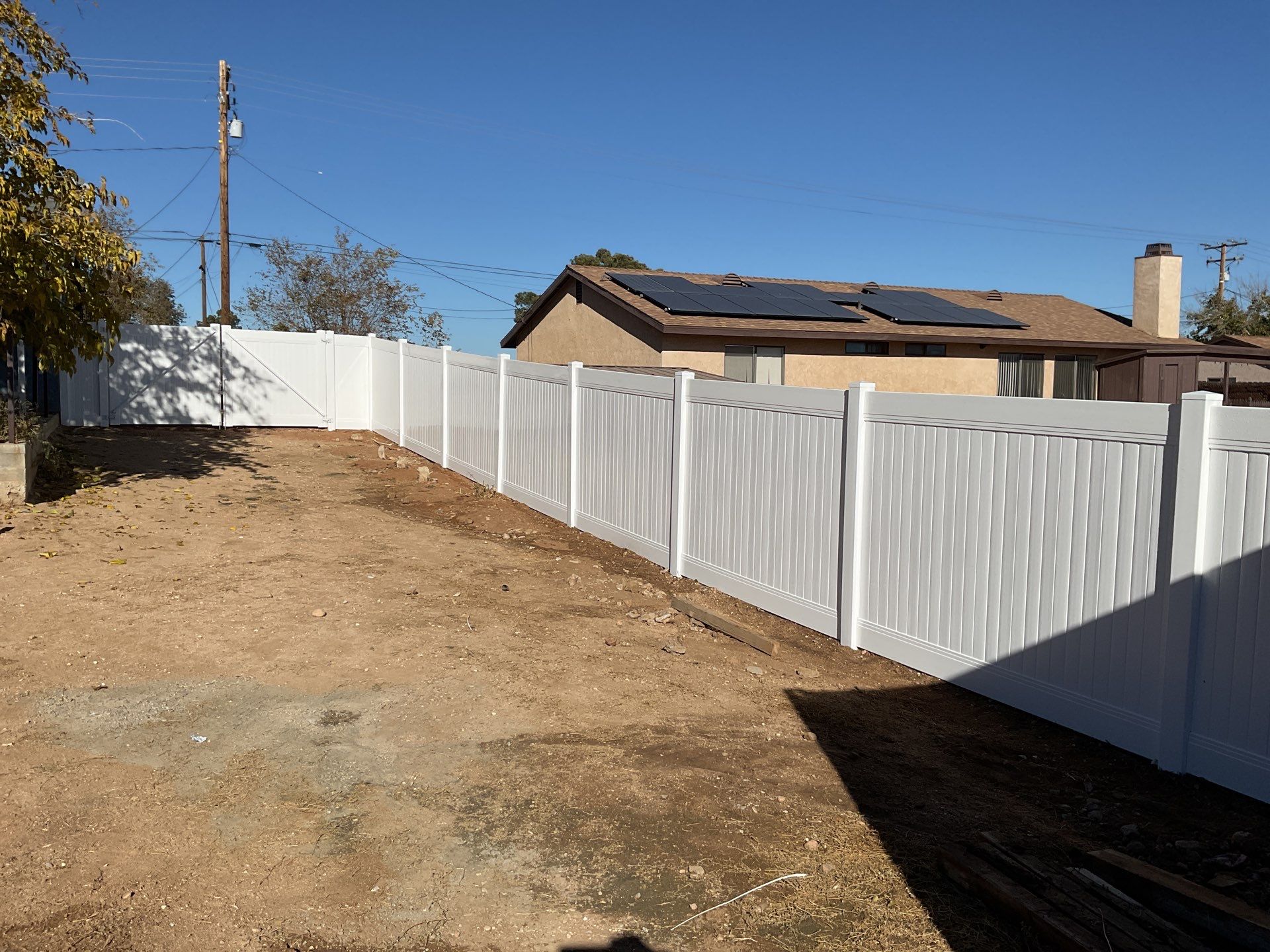 Fence Installation using vinyl and chain link  by Fence Guys Inc. 