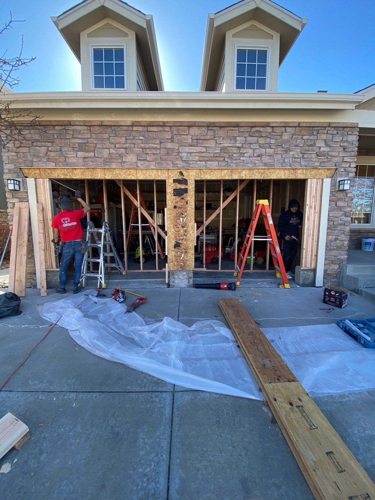 Garage door conversion by David & Goliath Contracting 