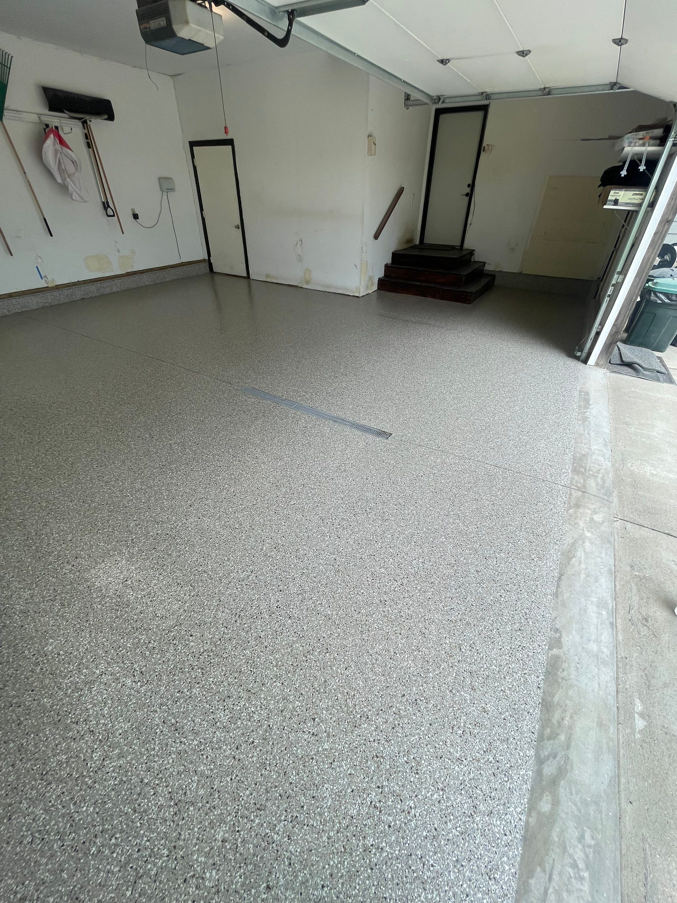 Hartford Residential Garage Floor Transformation With Decorative Chip Coating by Select Painting, Coatings & Garage Cabinets