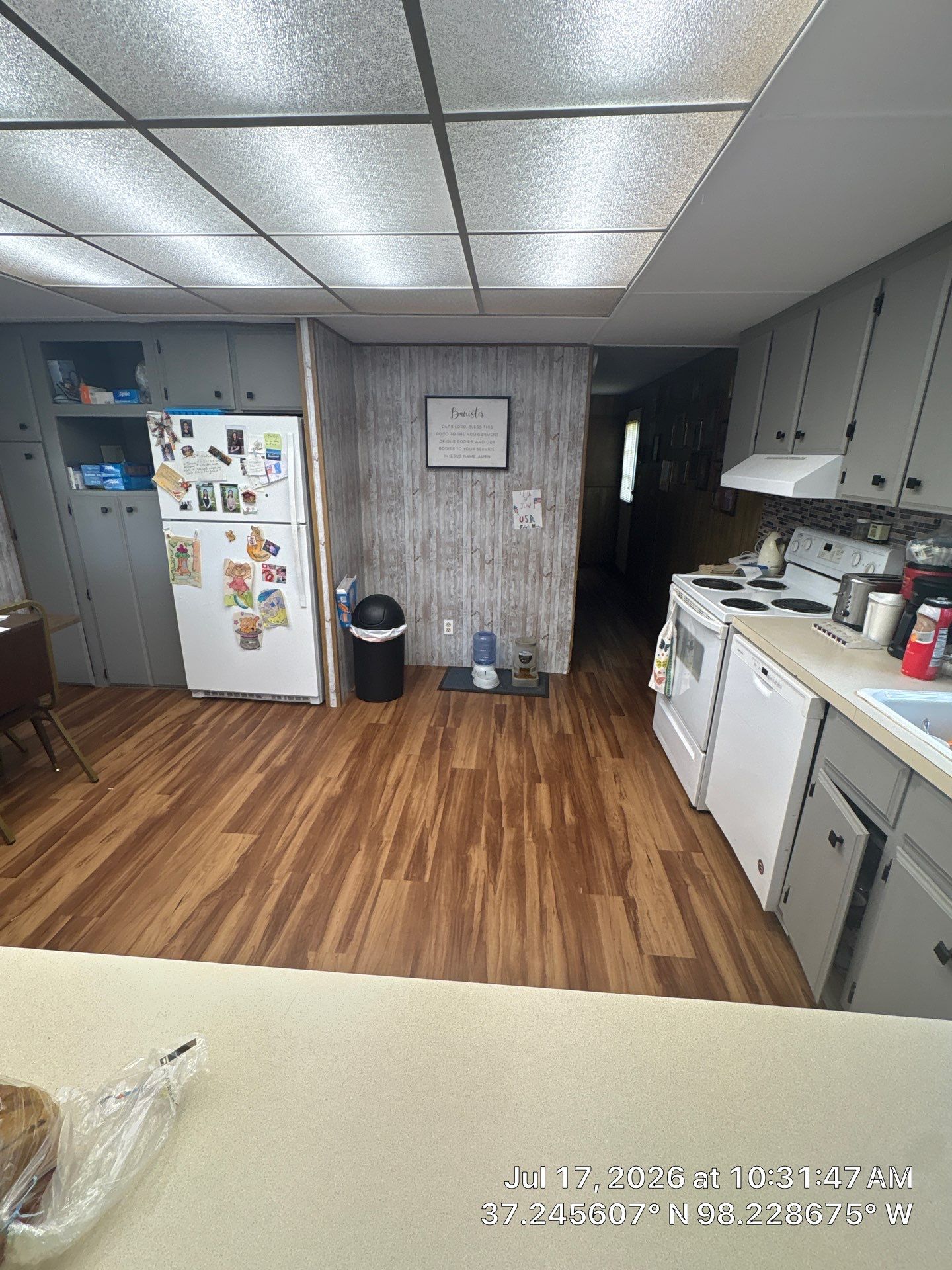 Attica Kitchen Remodel Featuring Gray Cabinets and Glass Tile Backsplash by CompanyCam Sales Demo
