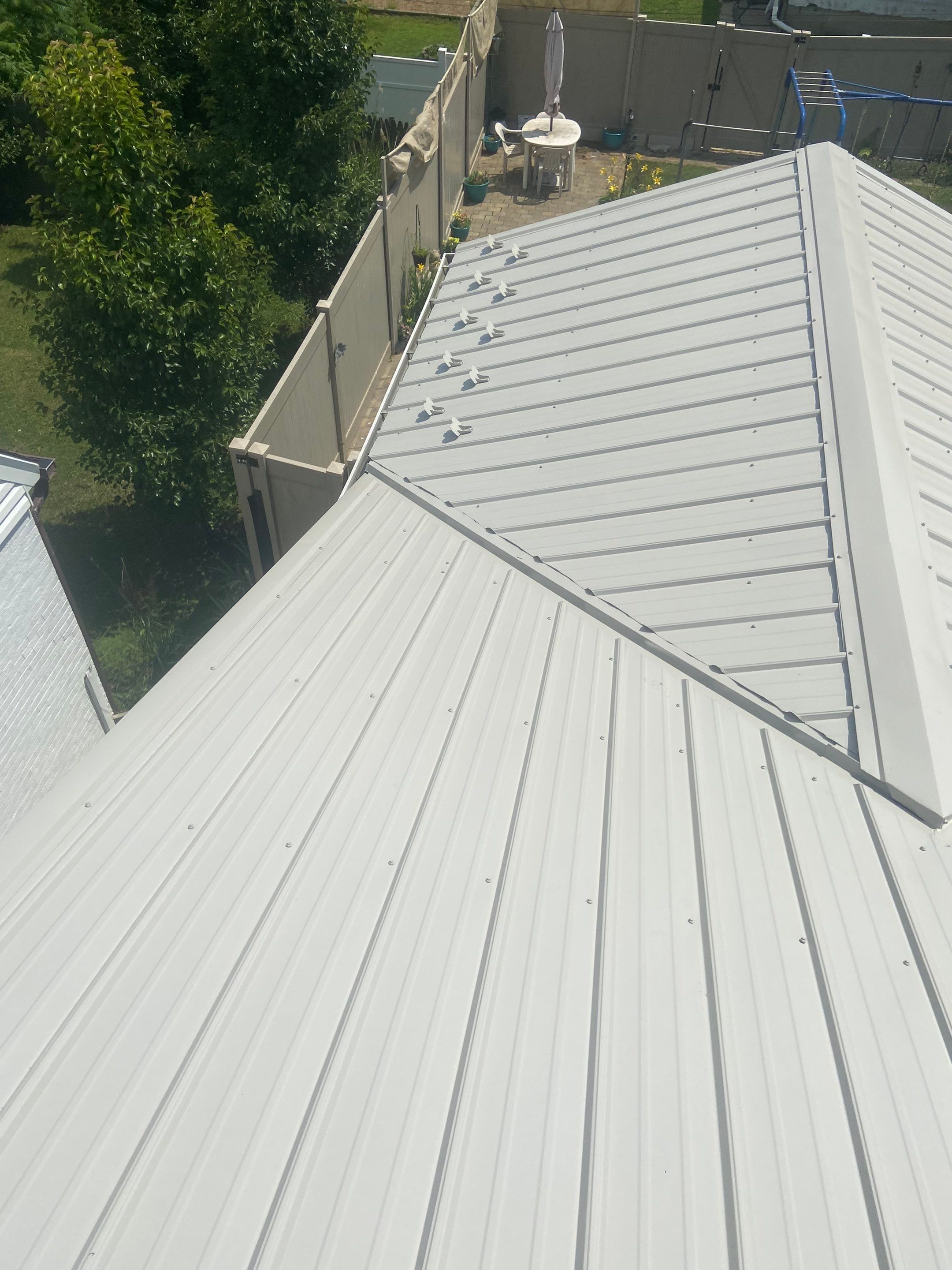 Metal Roofing, Skylights, Porch Build by Secure Construction Company Inc