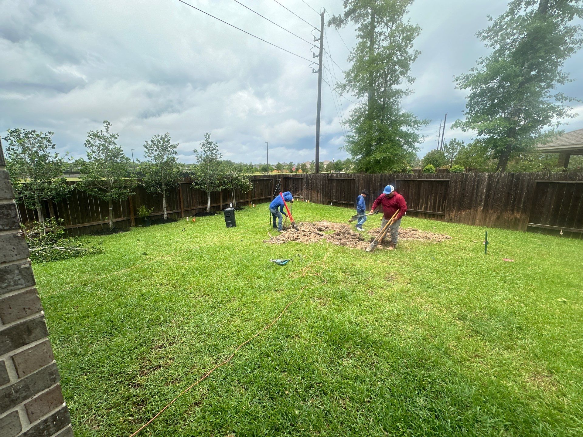 Covered patio and Summer Kitchen in Spring, TX by SophAlx LLC