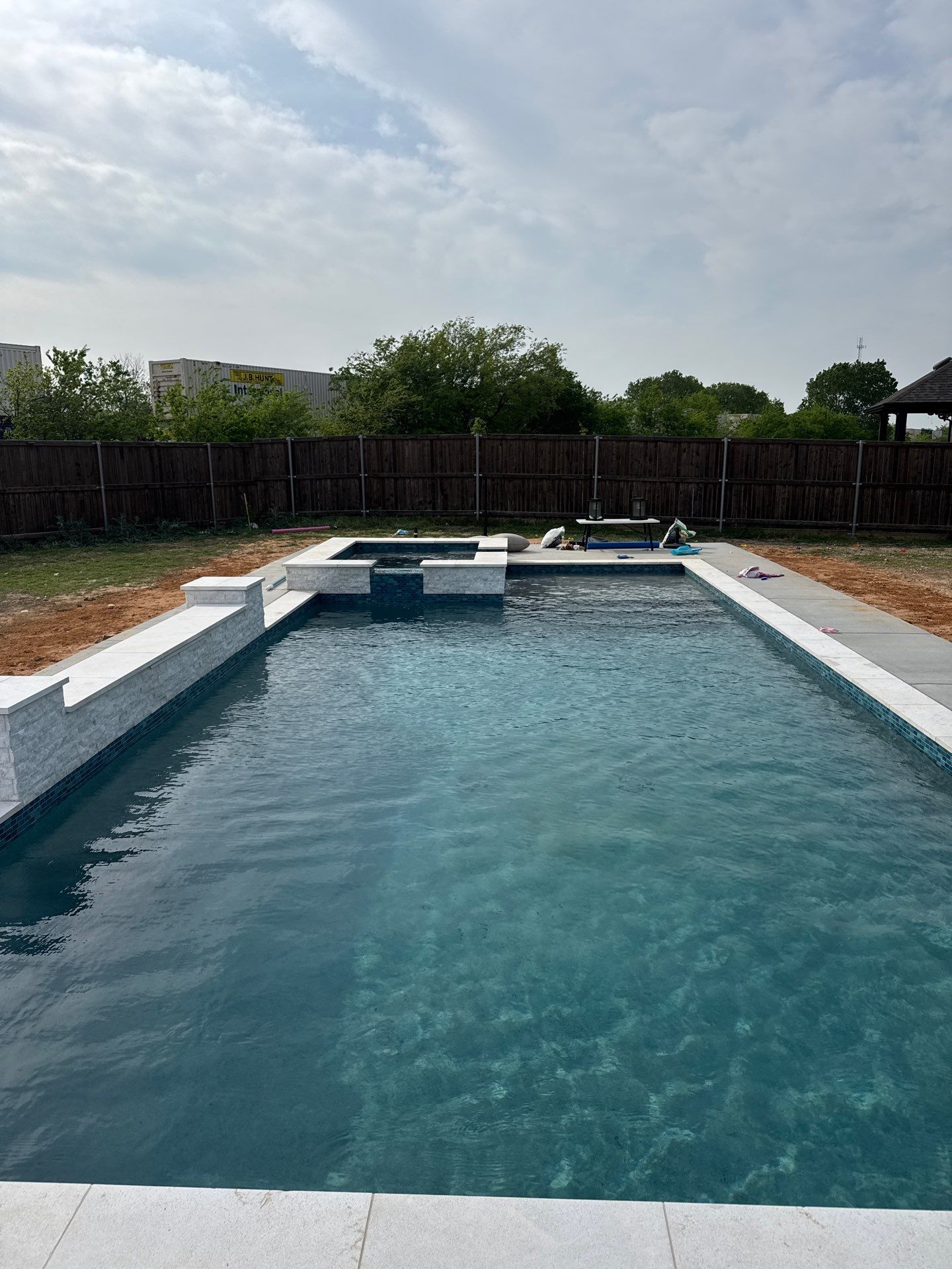 Geometric Pool with Elevated Spa and Night Lighting by Pinnacle Pools and Spas - DFW