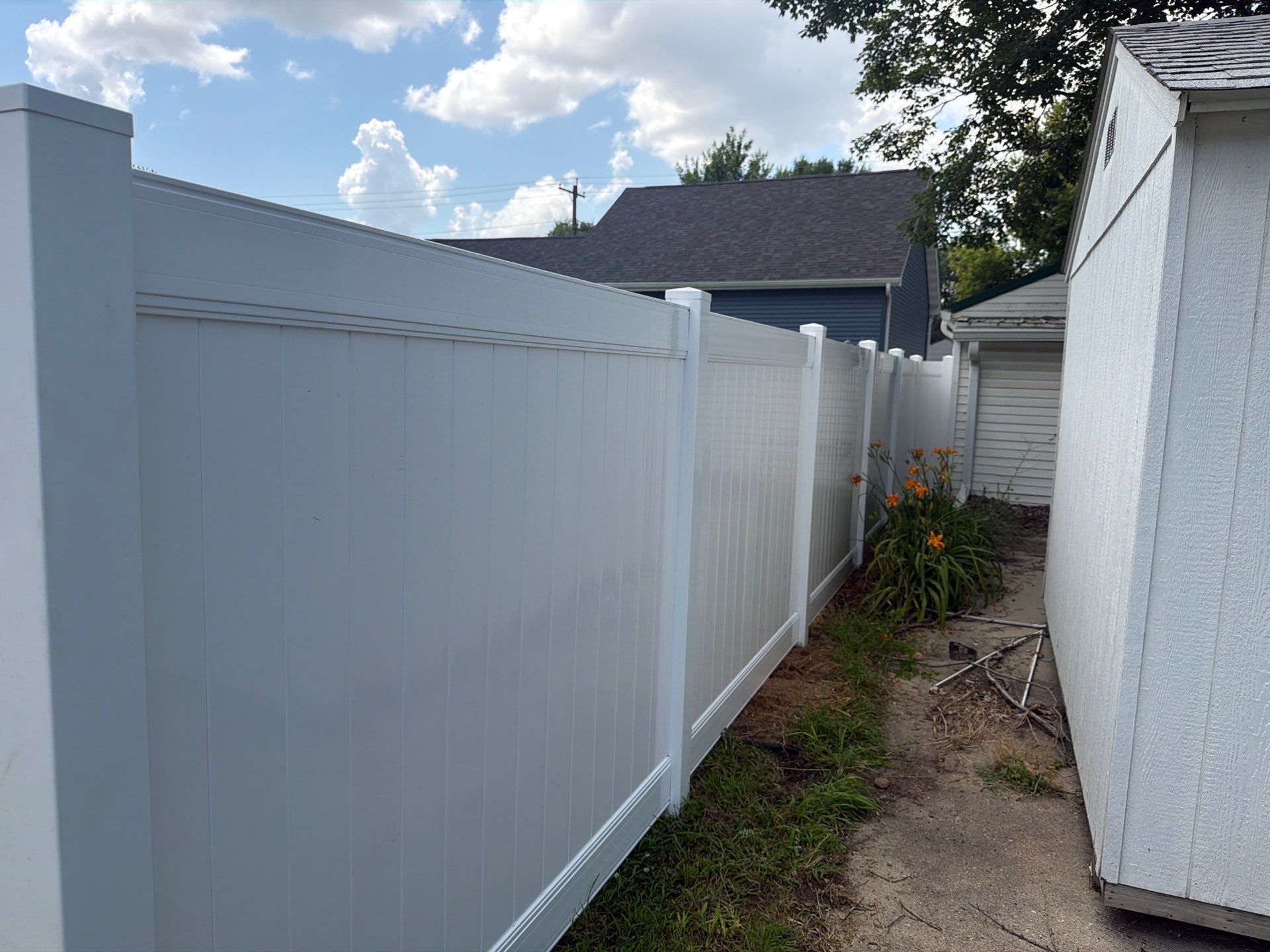 White Vinyl Privacy Fence Installation in Waterloo, Iowa by Perfect Picket Fence and Stain