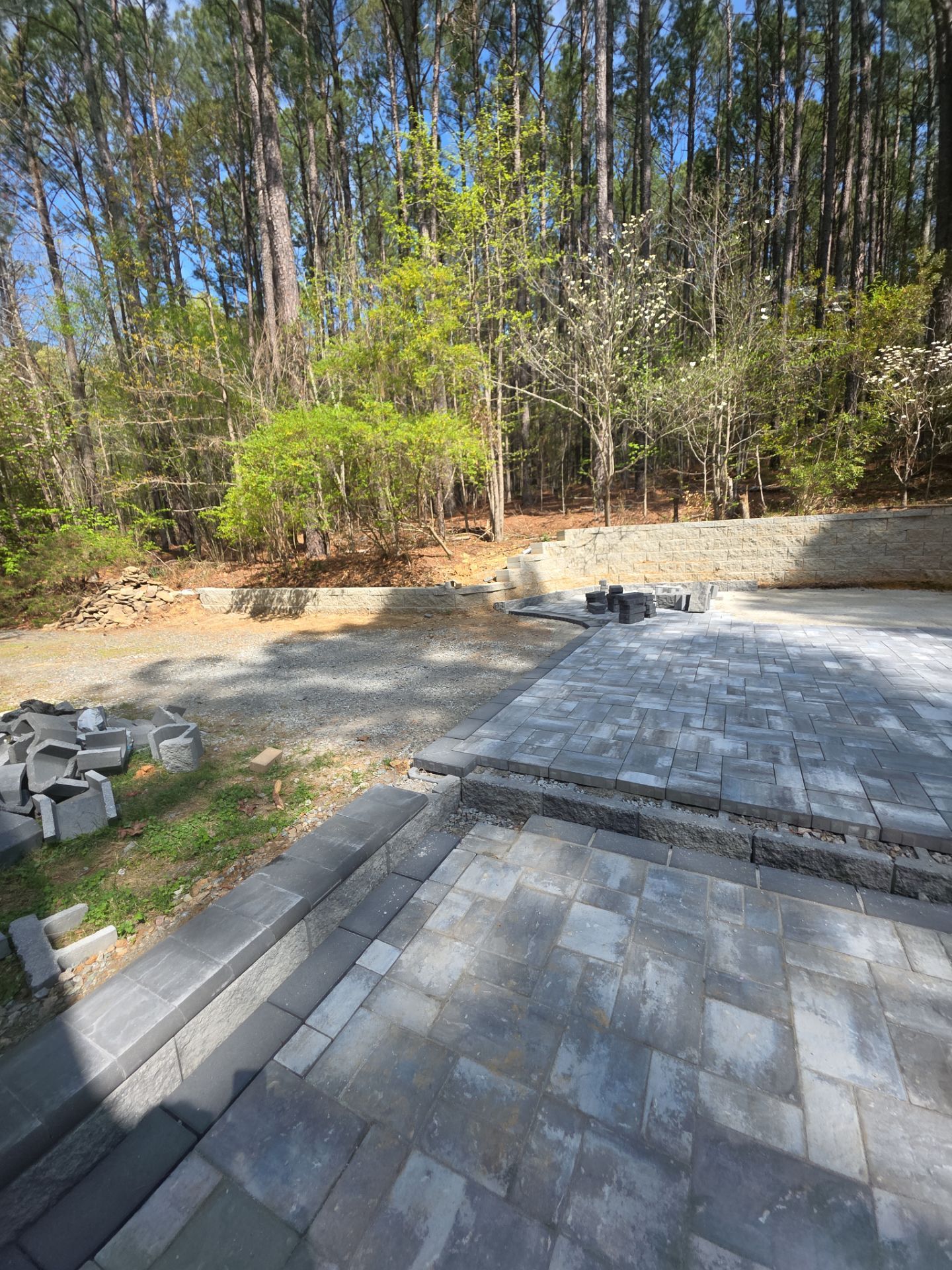 Pittsboro Outdoor Living Transformation – Retaining Wall, Paver Patio & Elevated Deck by Elite Remodeling and Design LLC