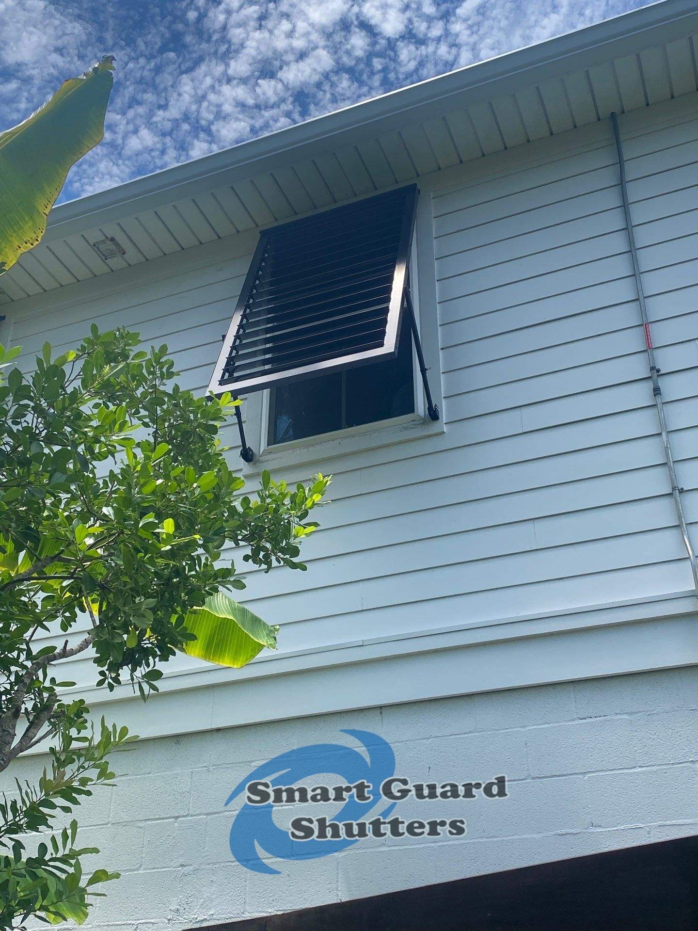 Impact Bahama Shutters in Jet Black by Smart Guard Shutters
