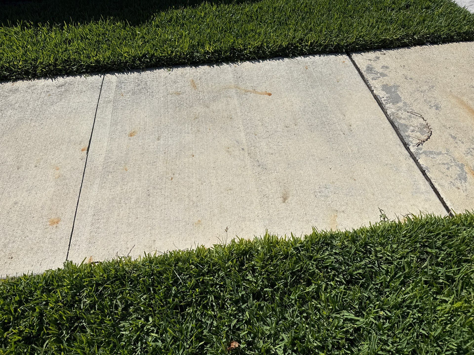 Rust Stain Removal from Concrete Driveway and Pavers in Park East at Azario | Lakewood Ranch, FL by Sunshine AquaWash