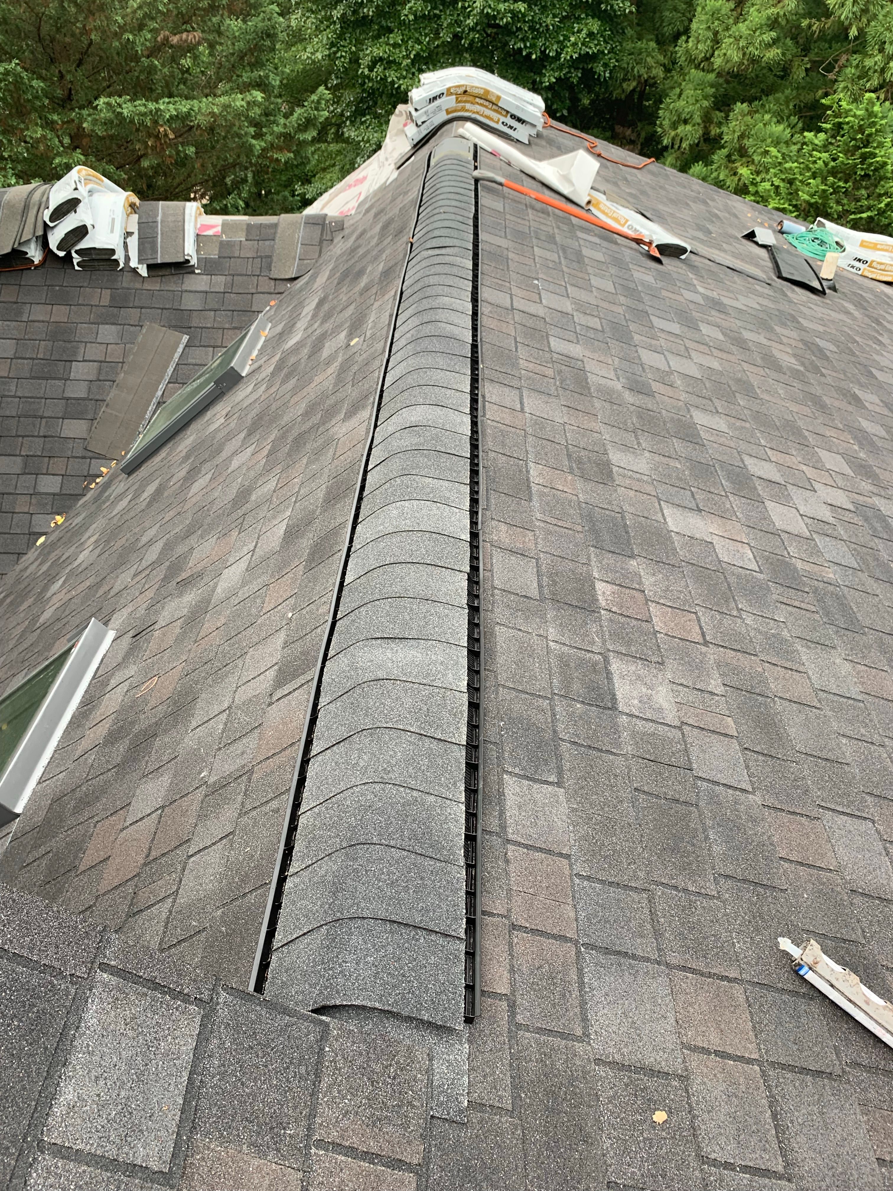 Skylight, Roof, and Gutter Replacement by American Home Contractors
