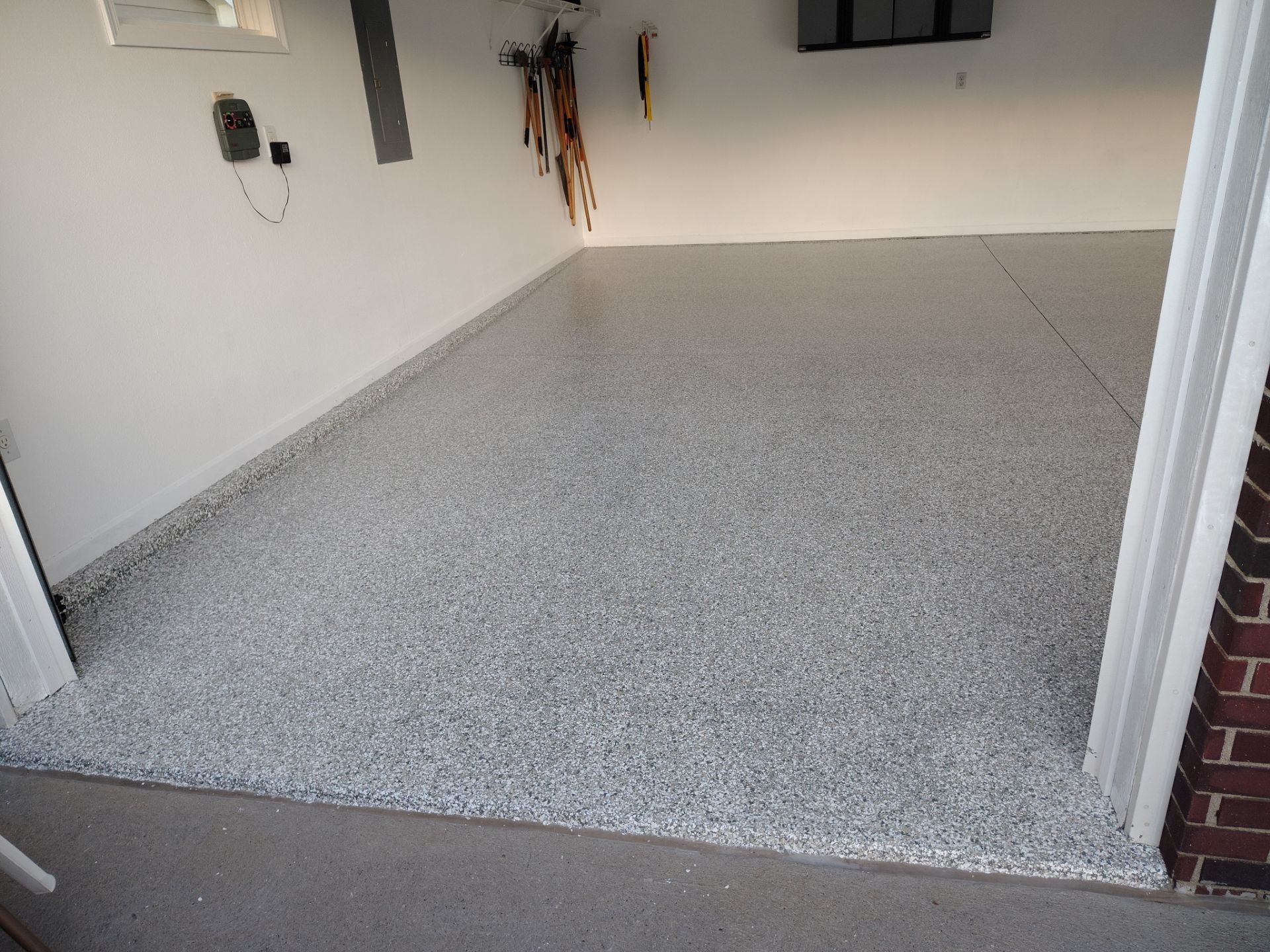 New Johnston Garage Resurfacing by Revival Concrete Coatings, LLC