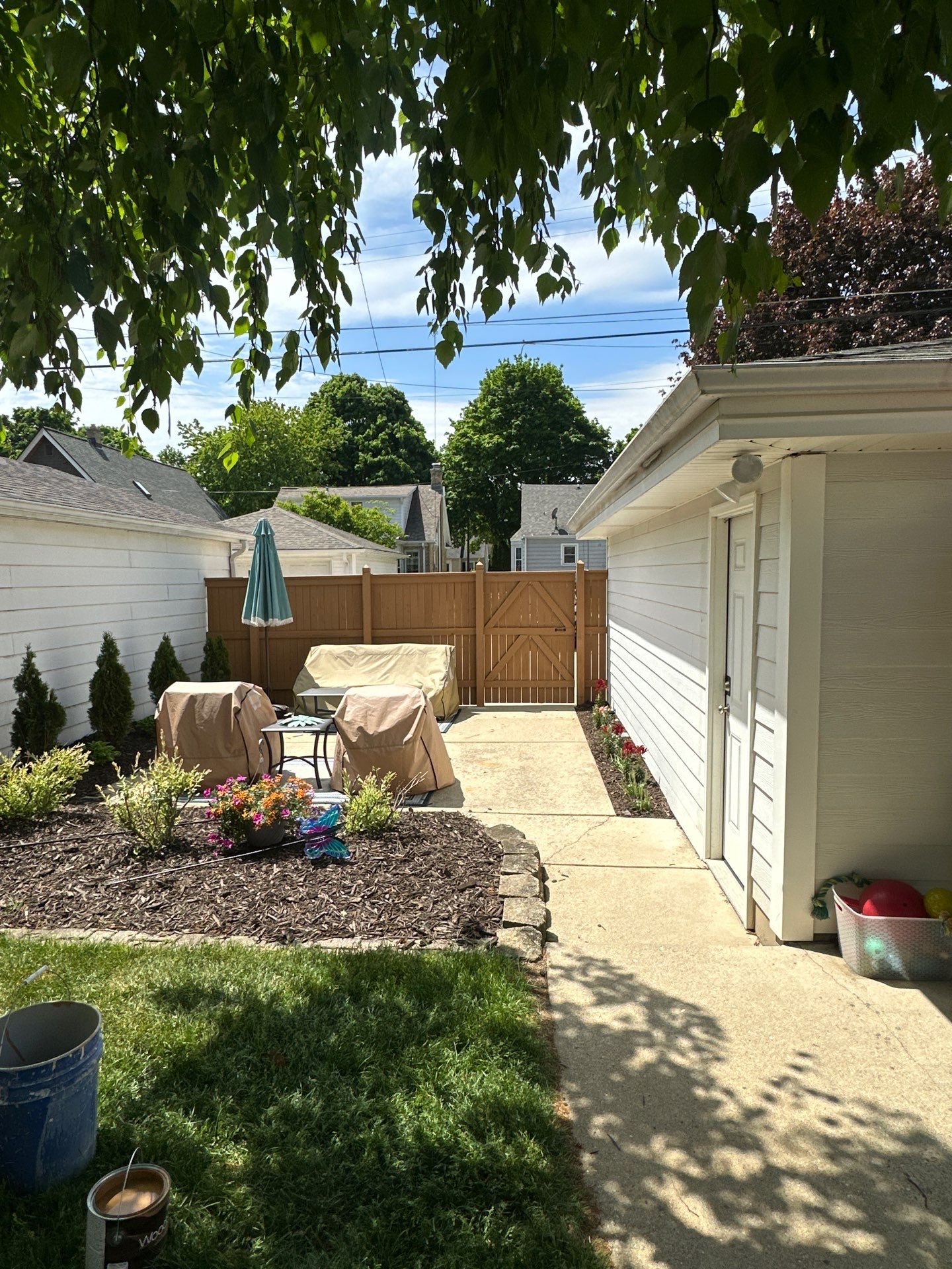 Milwaukee Wood Privacy Fence Installation and Concrete Patio Upgrade by OCS Contracting Services