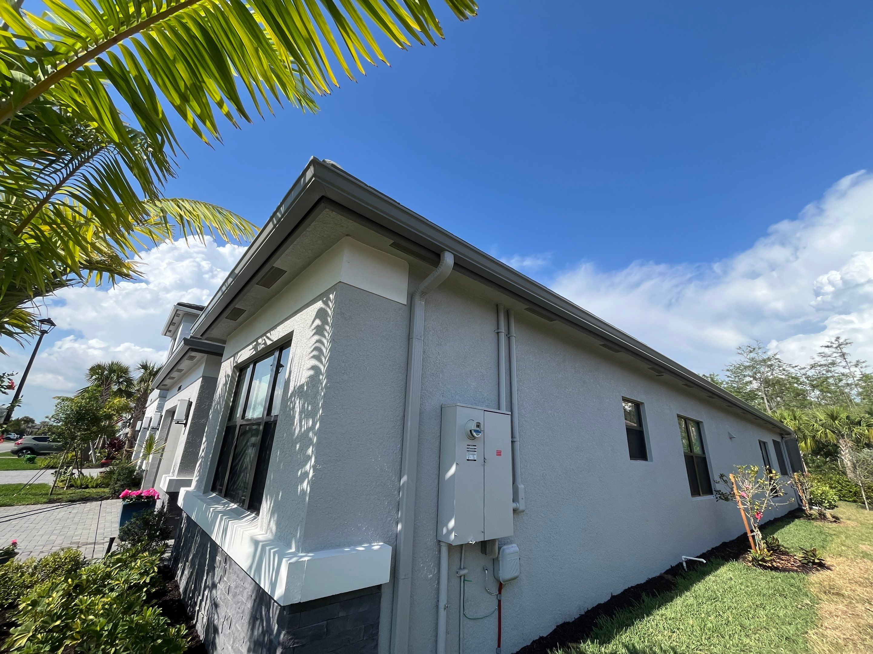 Grey Seamless Gutter Installation in Estero FL by Gutter Professors