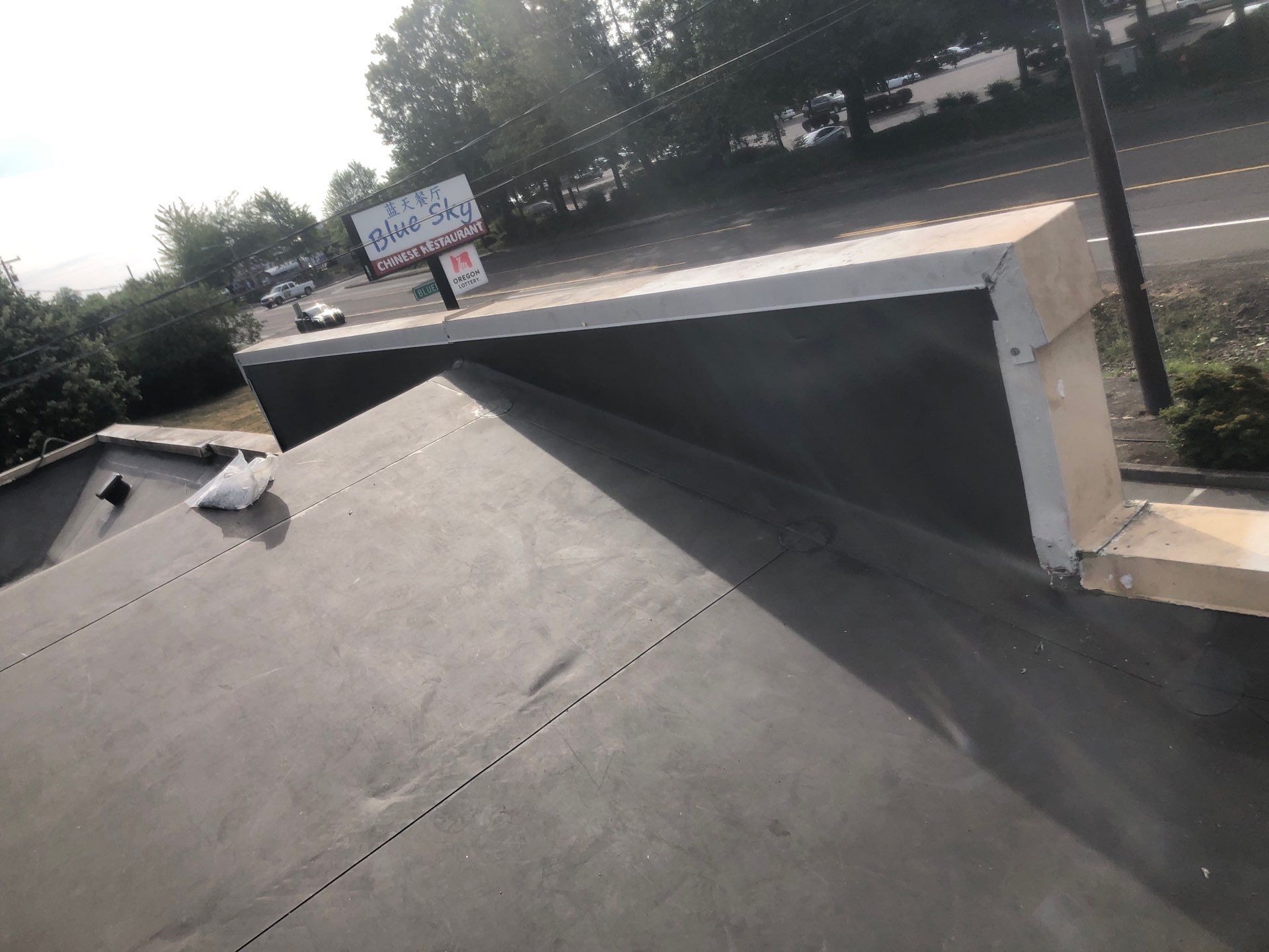 Commercial Flat Roof Installation using Bruce and Dana Snap Lock Metal (Color: Brown) by Orezona Building & Roofing Company, Inc.