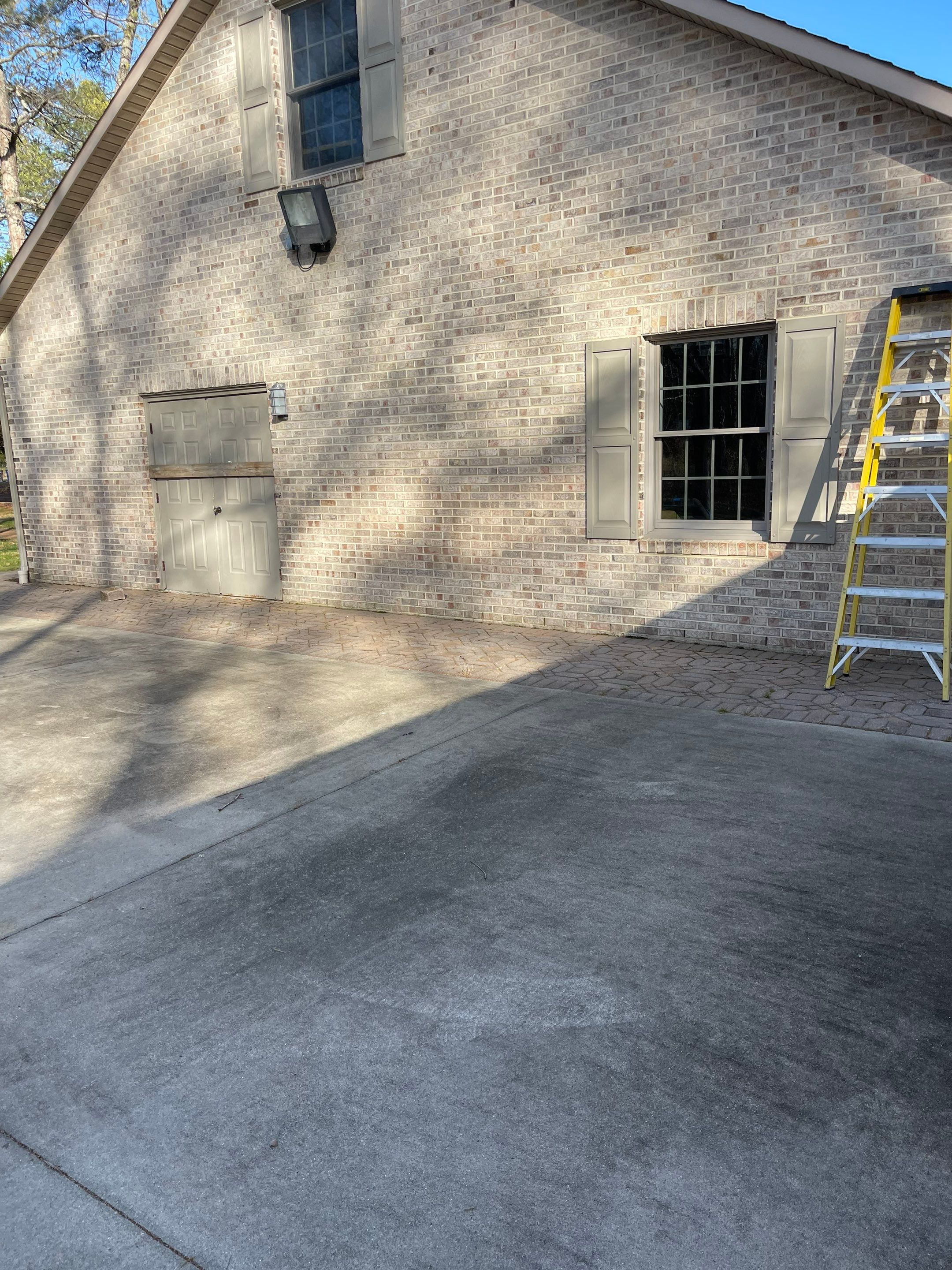 Pavers Cleaned, Garage and Concrete walls by SJ Exterior