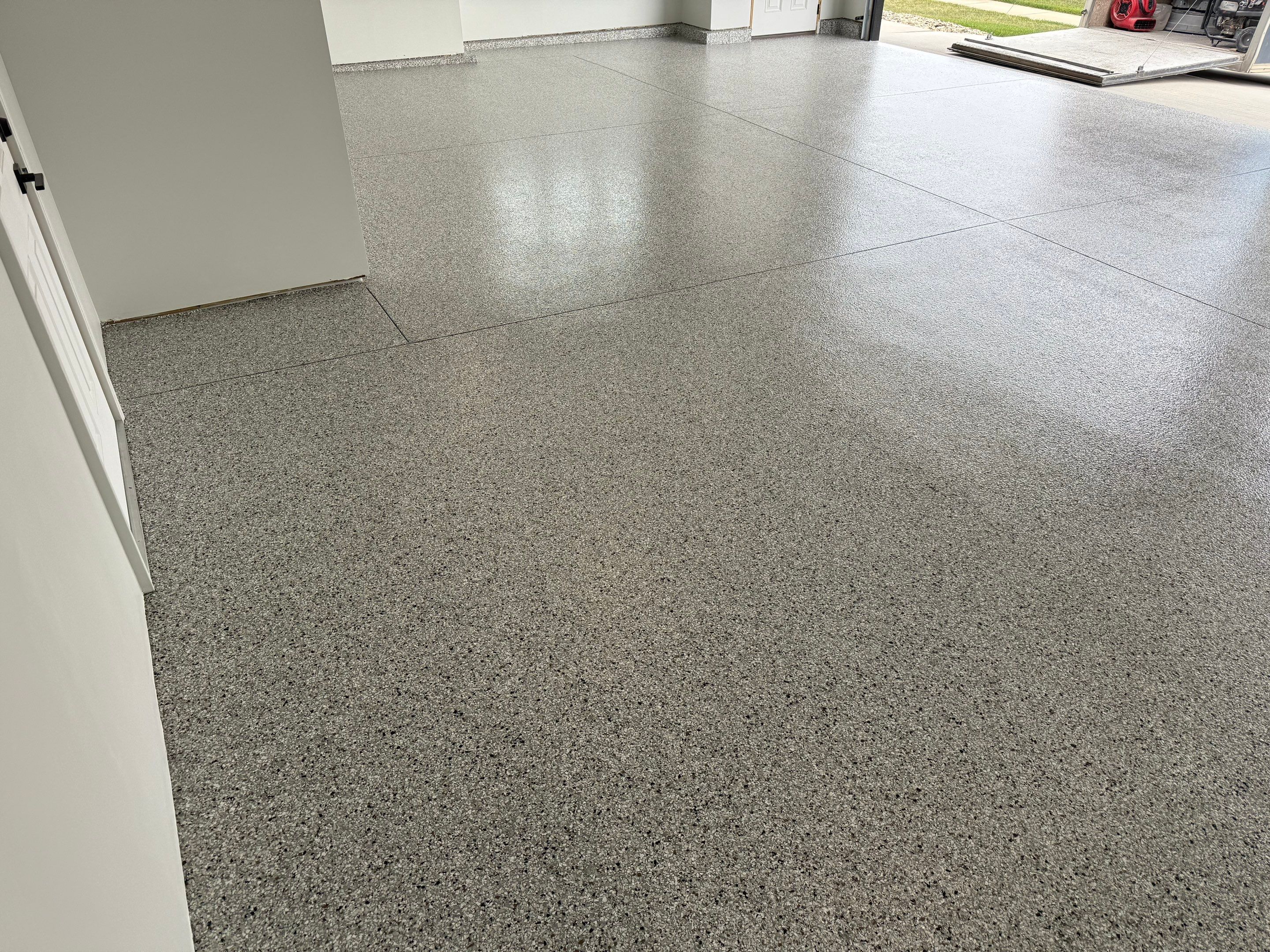 High-Gloss Epoxy Flake Garage Floor Coating in Brandon by Select Painting, Coatings & Garage Cabinets