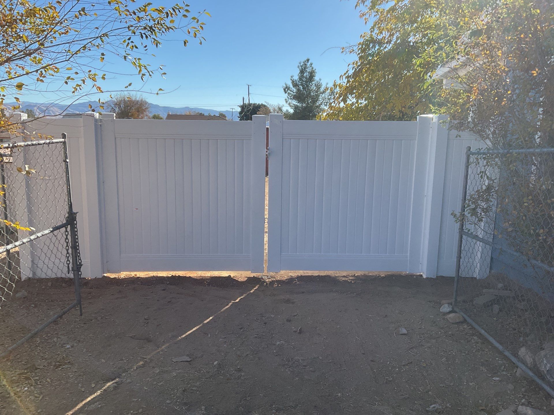 Fence Installation using vinyl and chain link  by Fence Guys Inc. 