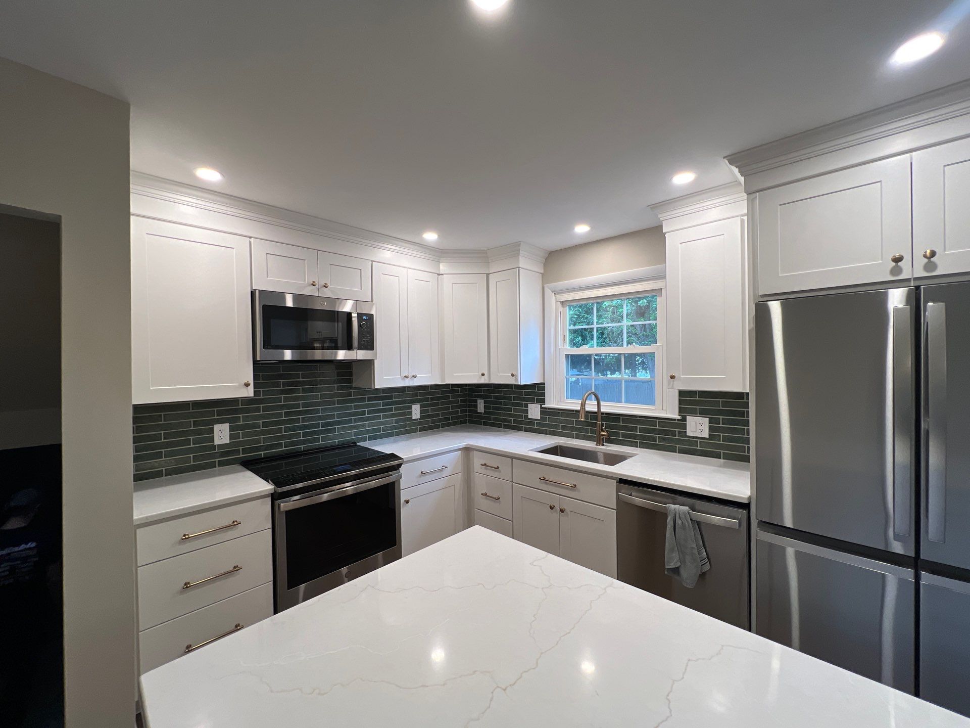 Phoenixville Kitchen Remodel with White Shaker Cabinets and Green Backsplash by Reliable General Contracting
