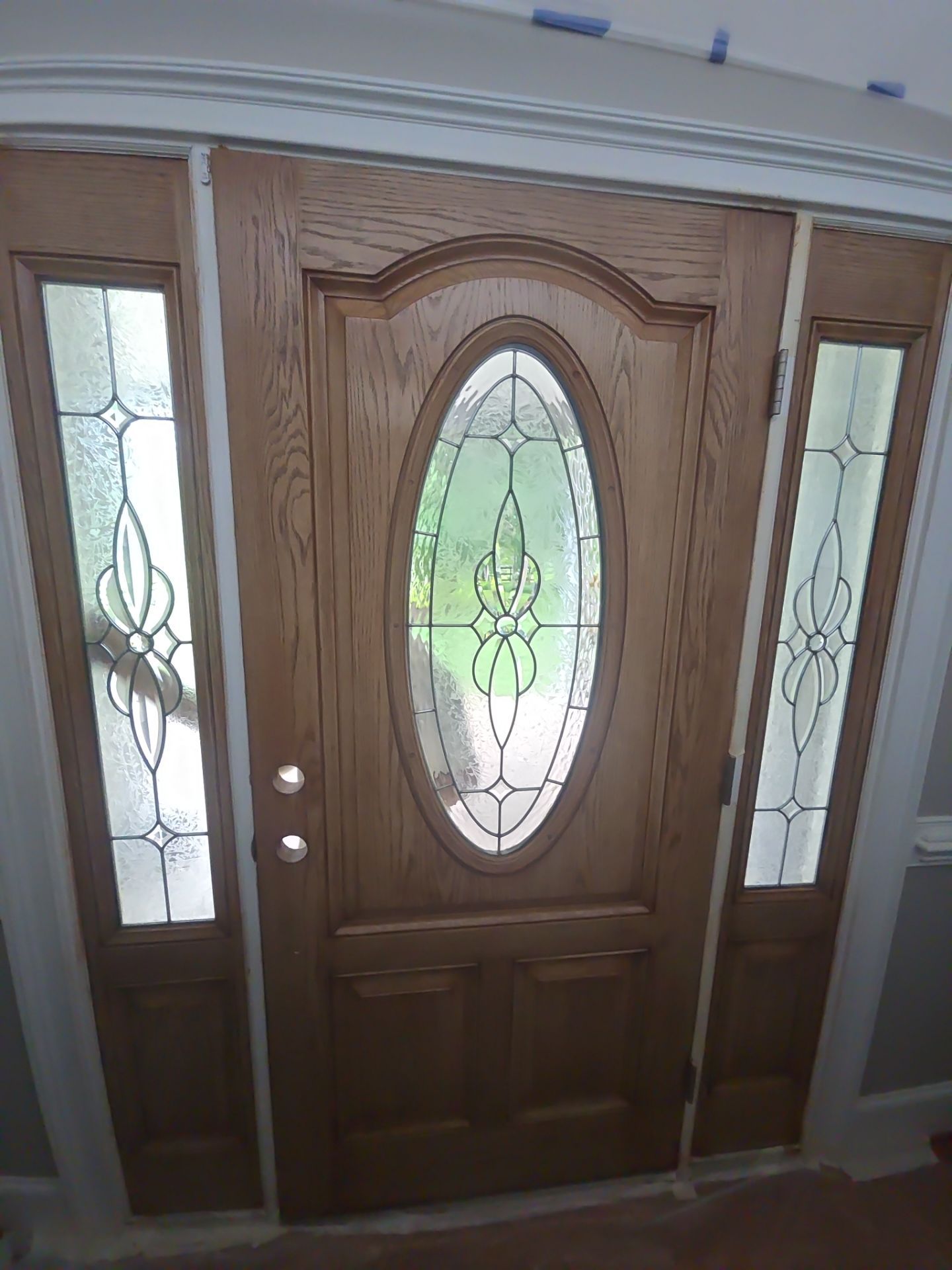 Siding replacement, exterior painting, and front door staining. by GonzalezPainters & Contractors Inc