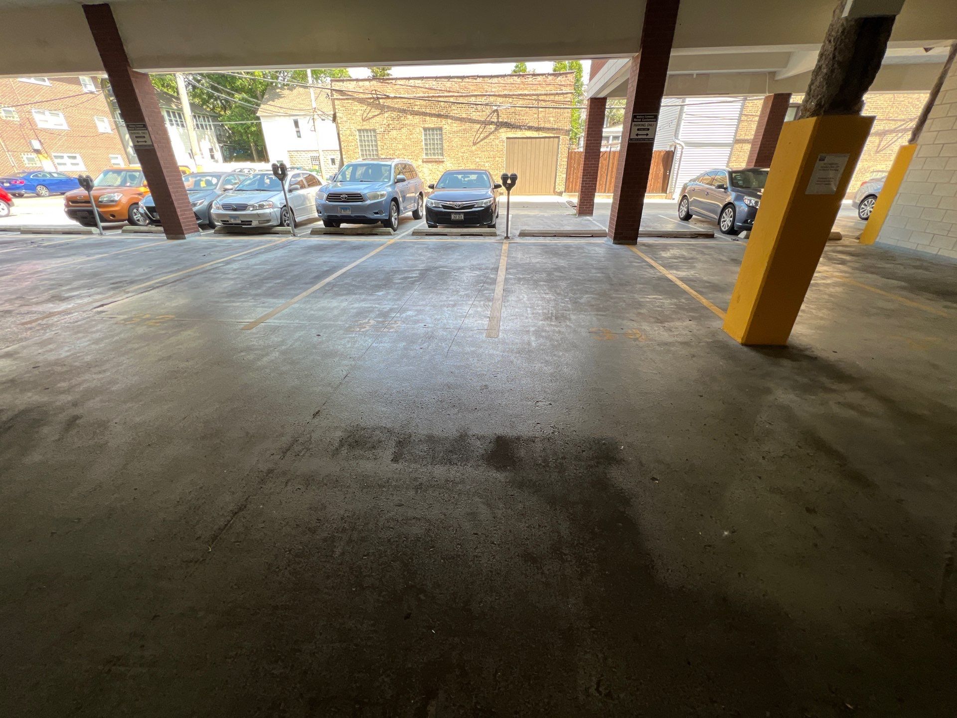 Parking garage using Hot water by Northern Power Washing LLC.
