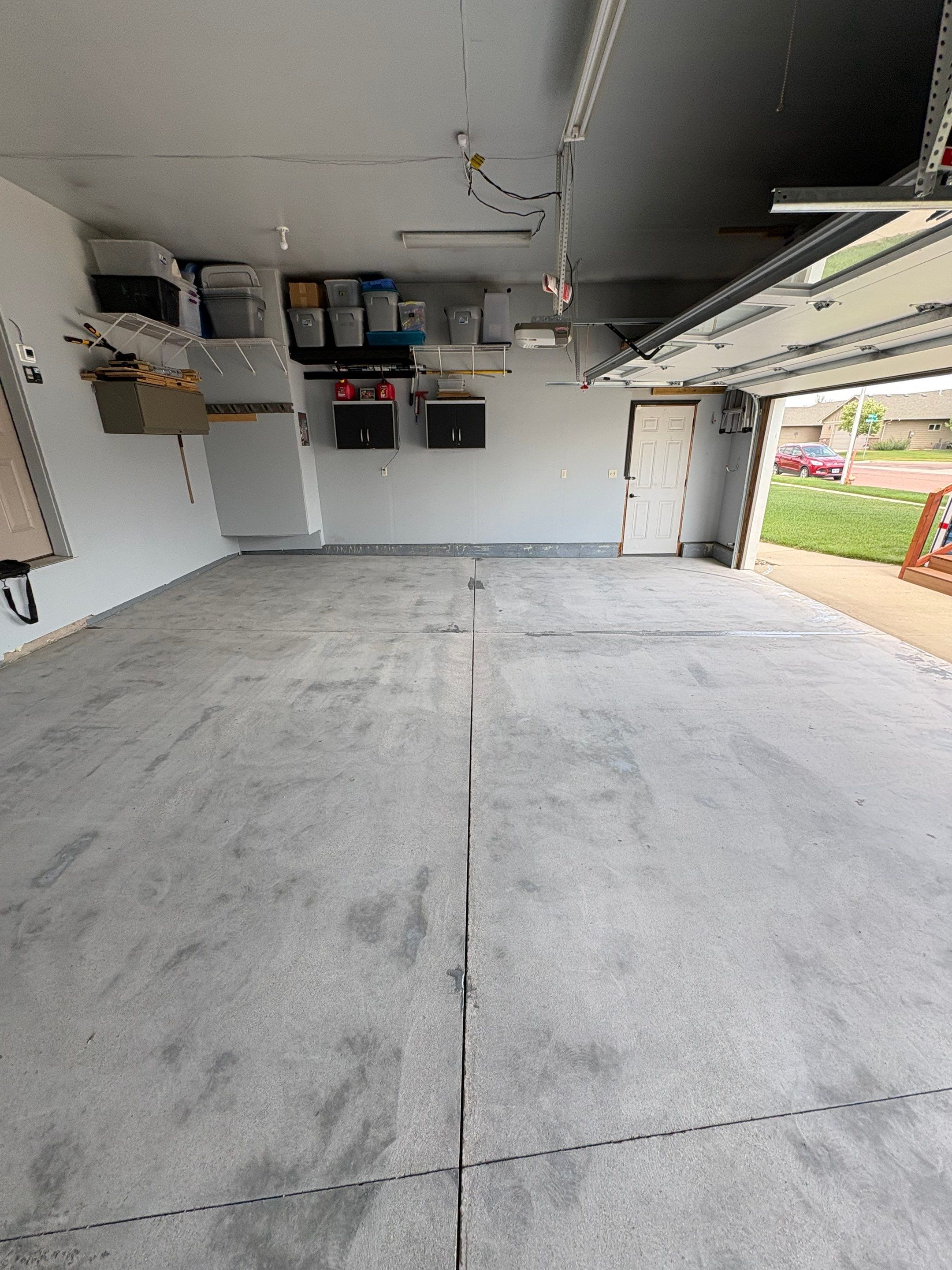 Sioux Falls Garage Concrete Coating Installation with Domino Flake by Select Painting, Coatings & Garage Cabinets