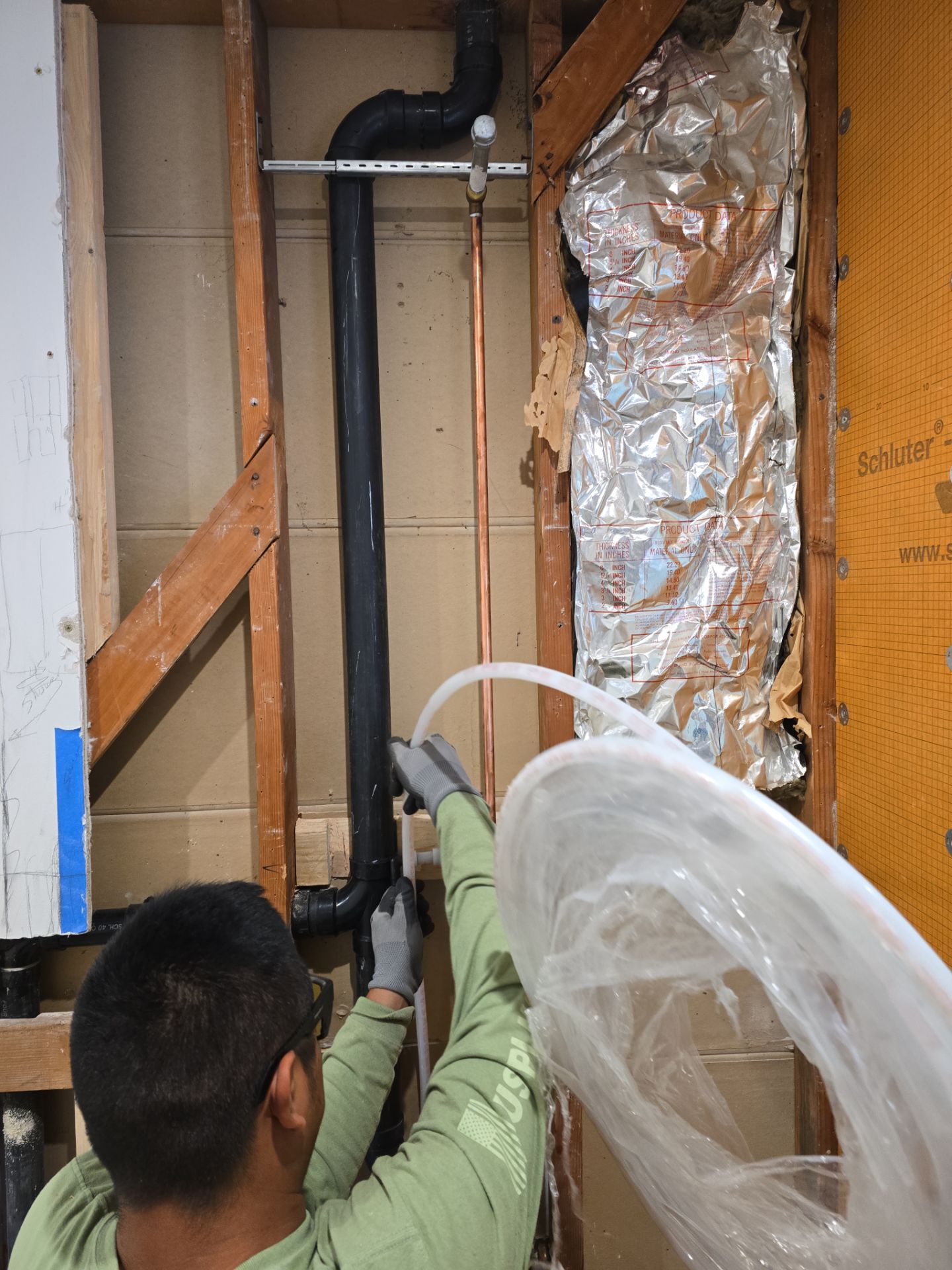 Installation of New Tall Black Piping (Wall to Ceiling) & Underground Piping by Us Plumbing