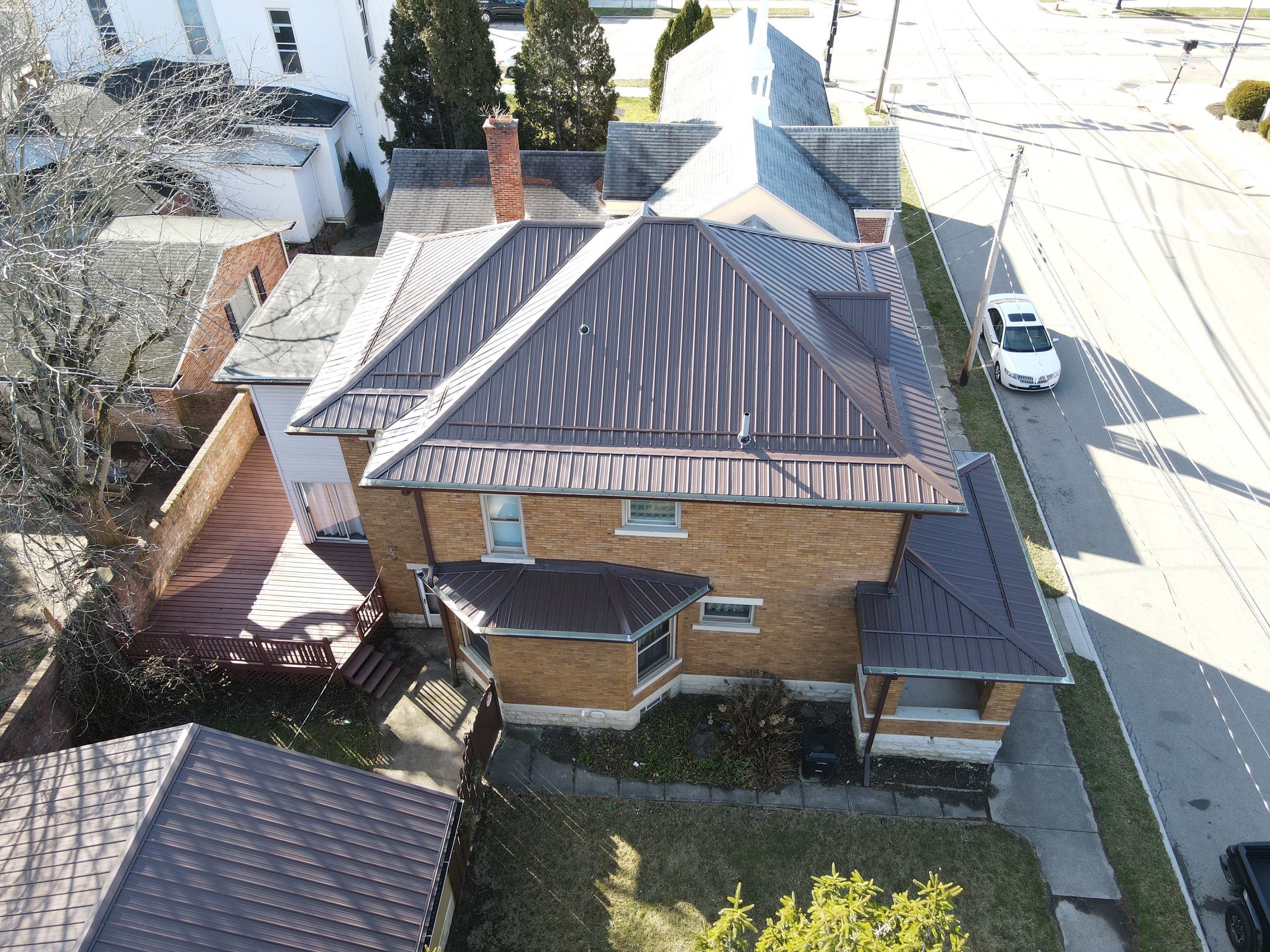 Residential Roofing Installation using Performance Panel Metal - Brown by RoofX